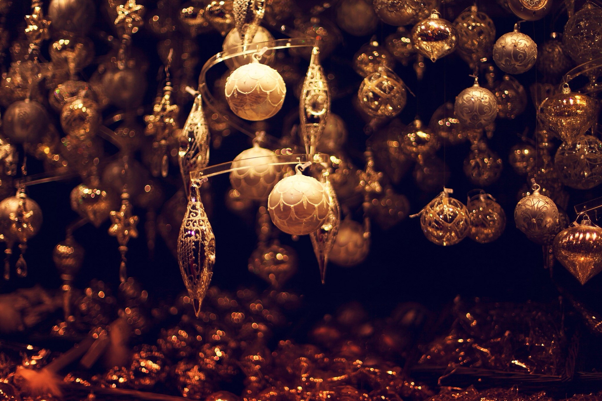 Christmas ornaments hanging in a store HD Wallpaper