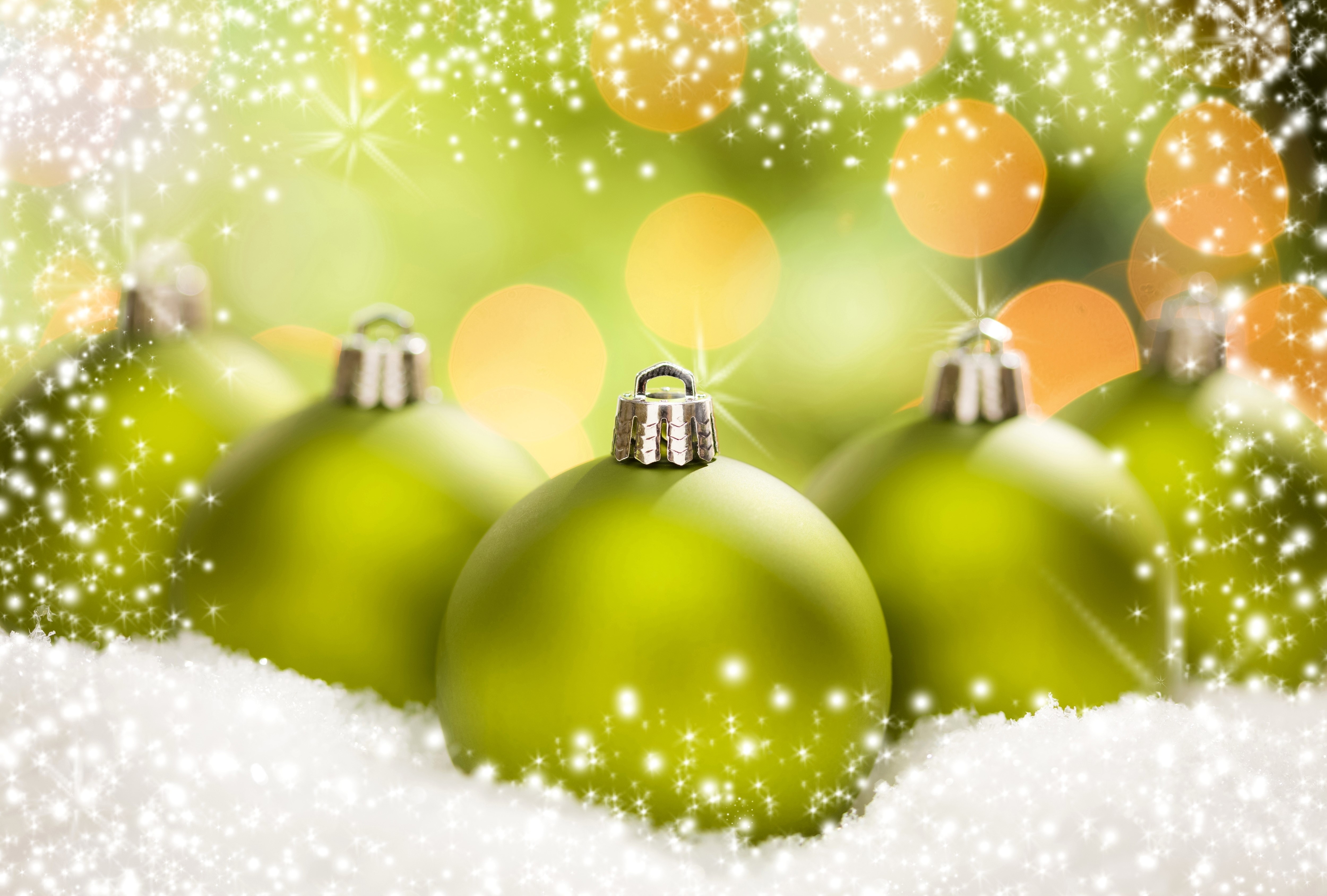 Christmas balls in snow with bokeh lights HD Wallpaper