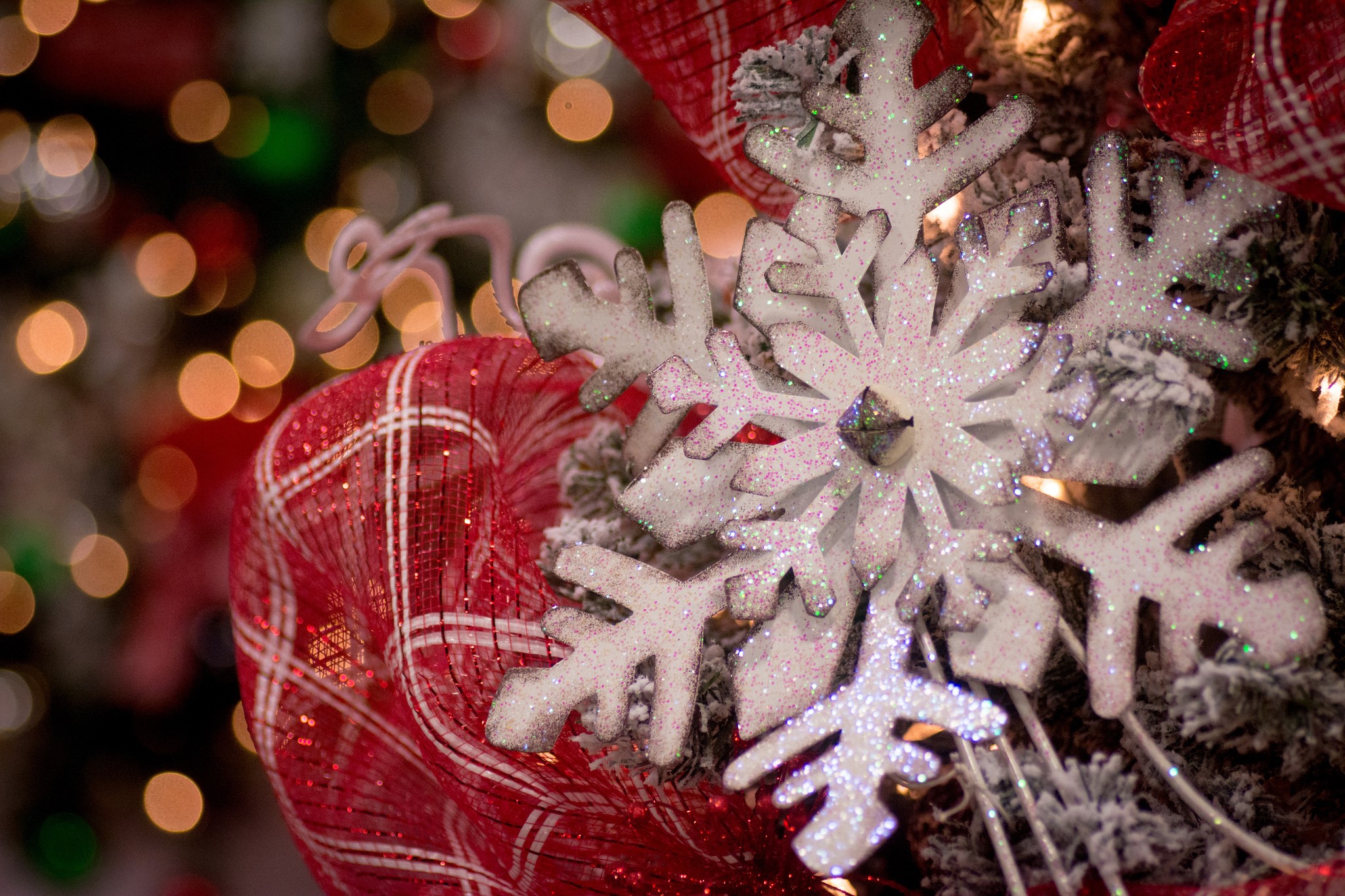 Glittering Snowflakes and Red Plaid Ribbon on a Christmas Tree HD Wallpaper