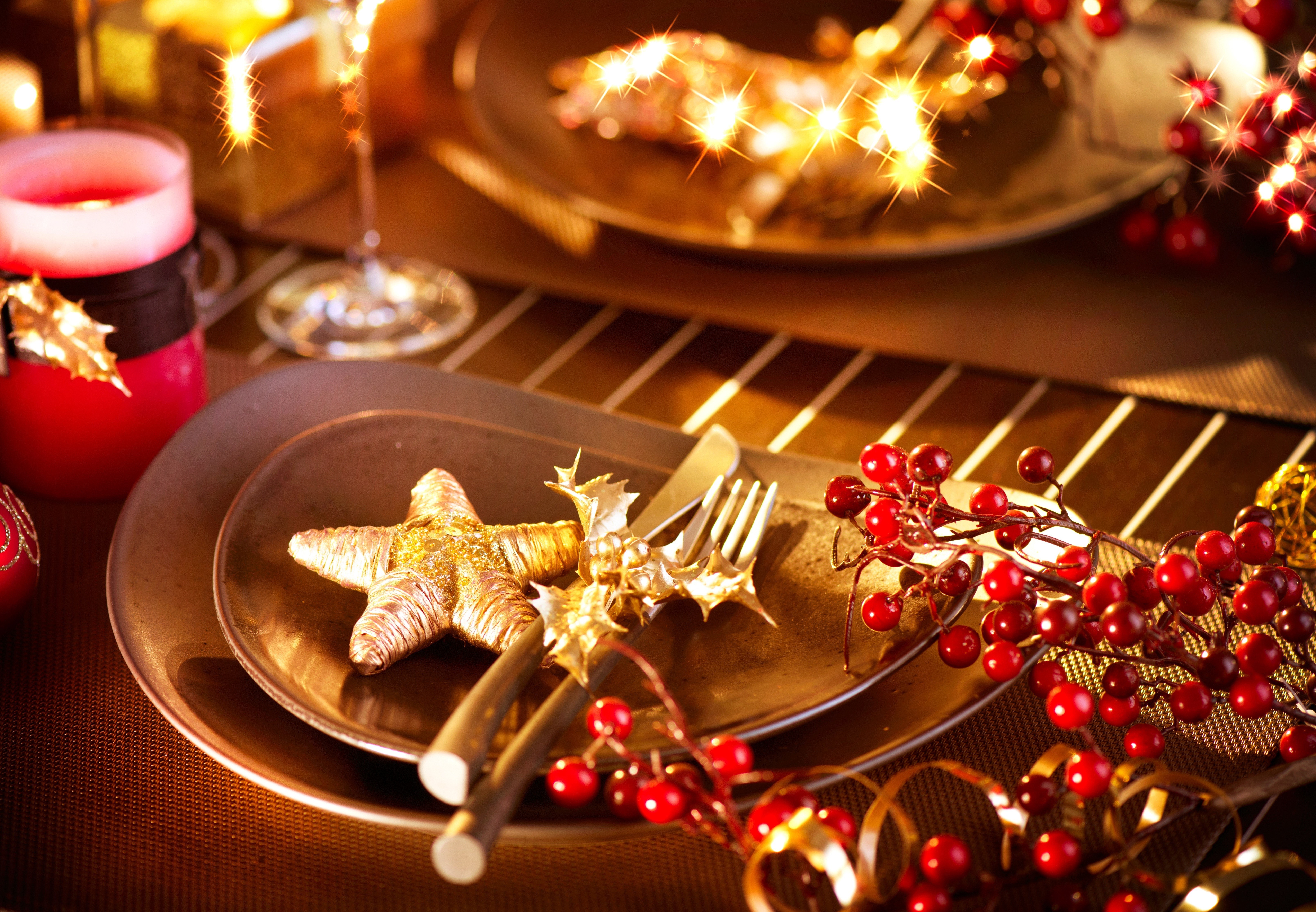 Christmas table setting with red candle and berries HD Wallpaper
