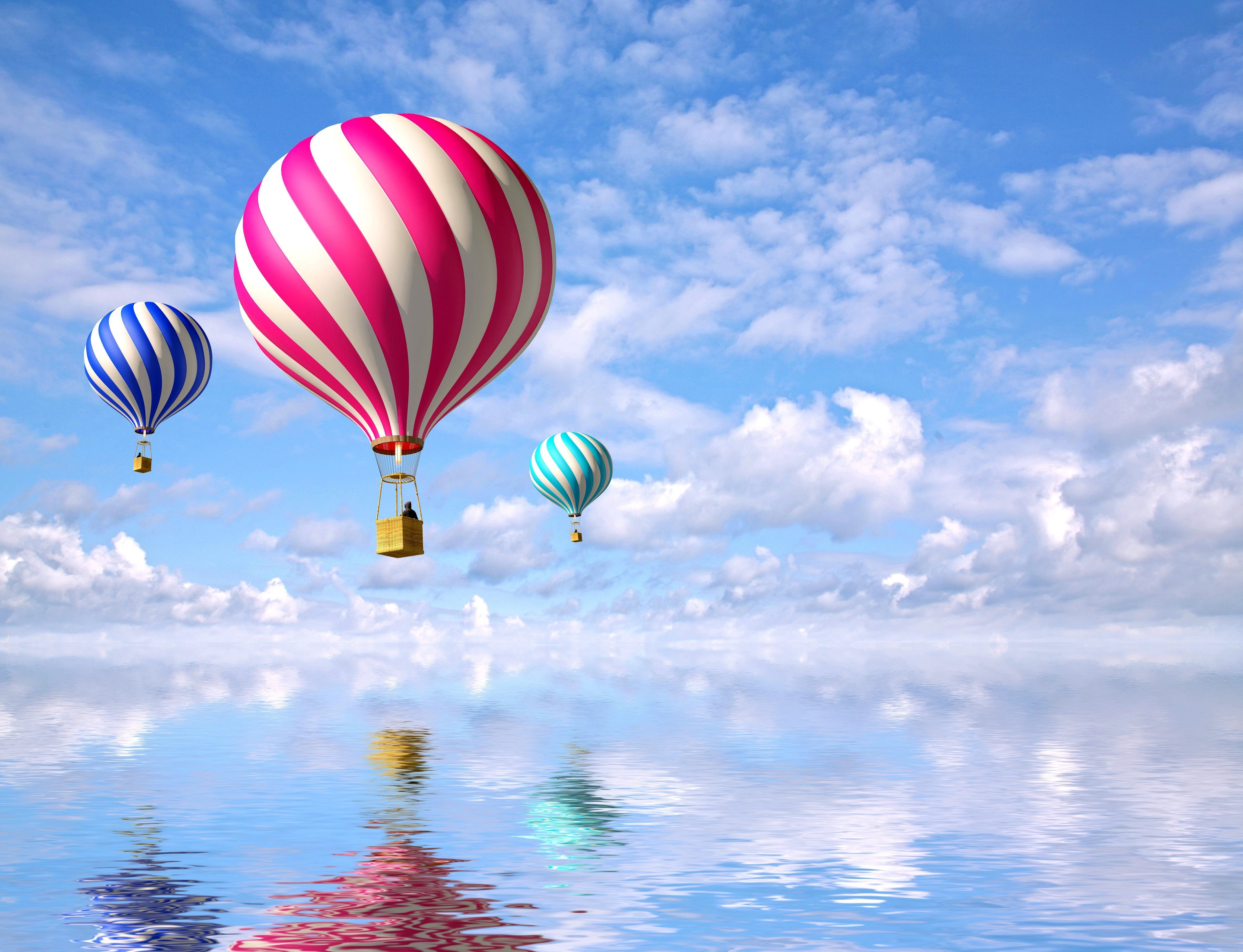 Three hot air balloons over water HD Wallpaper