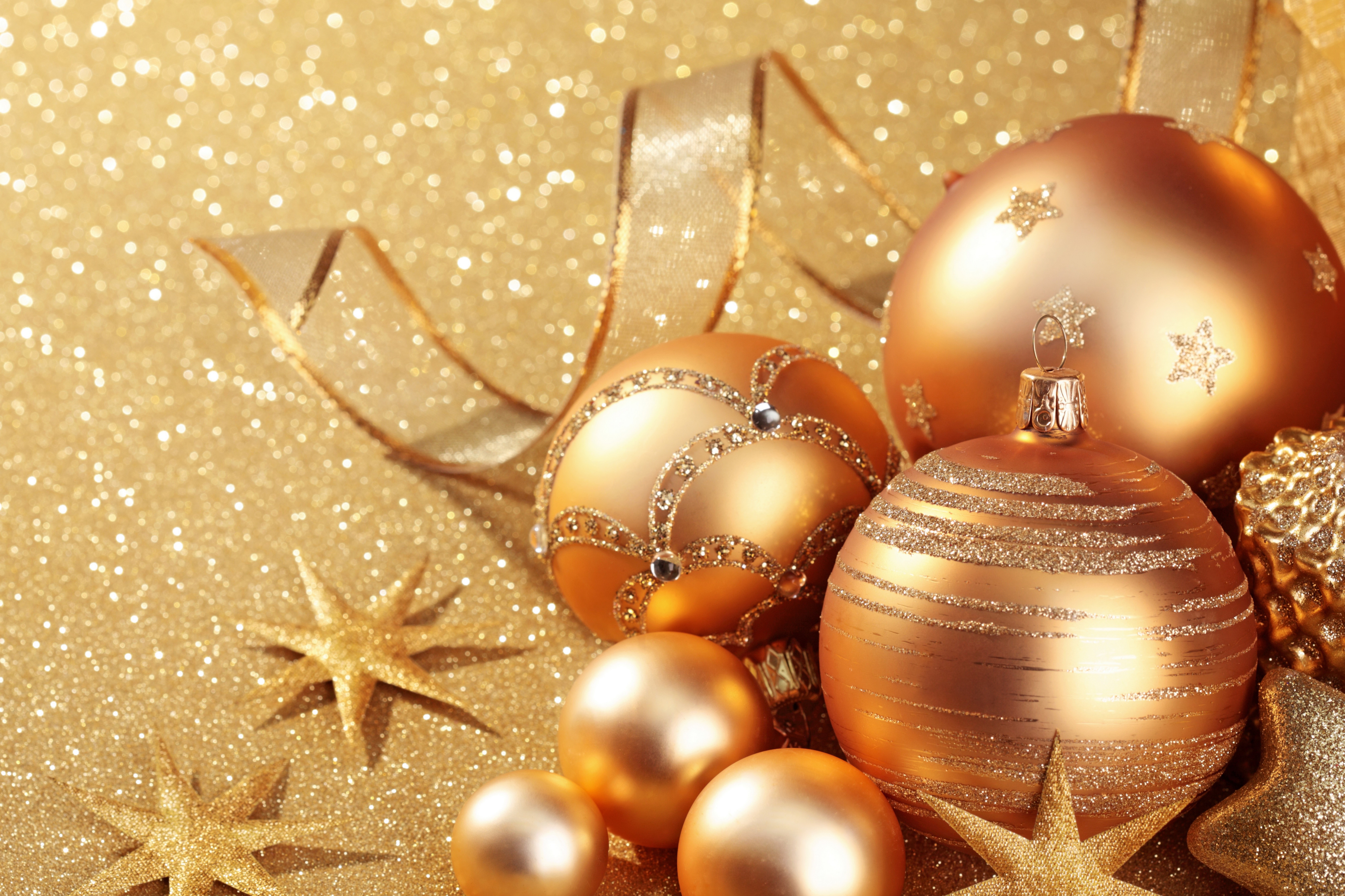 Christmas balls and stars on a gold background HD Wallpaper