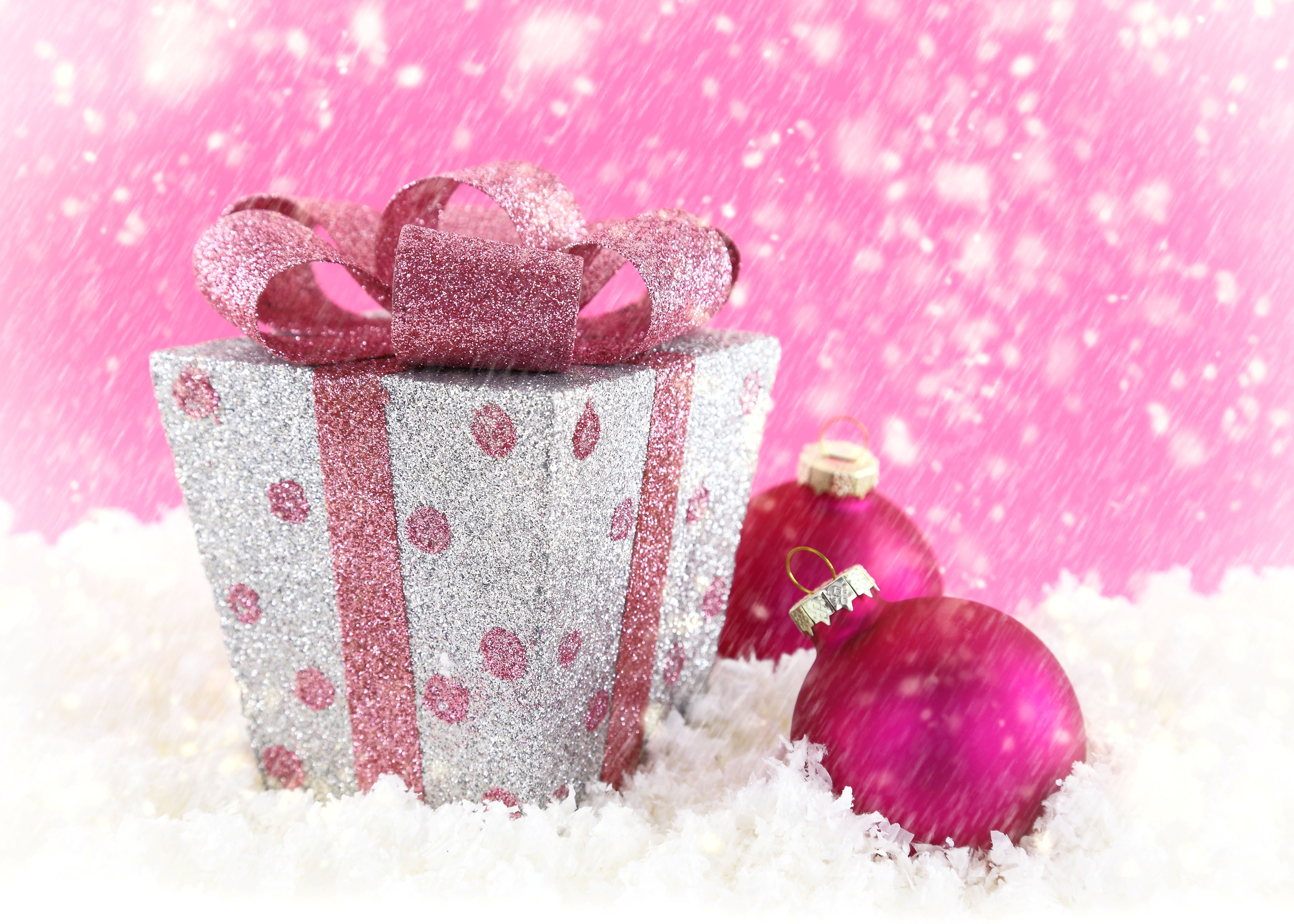 Sparkling Christmas Gift and Pink Ornaments in Snow HD Wallpaper