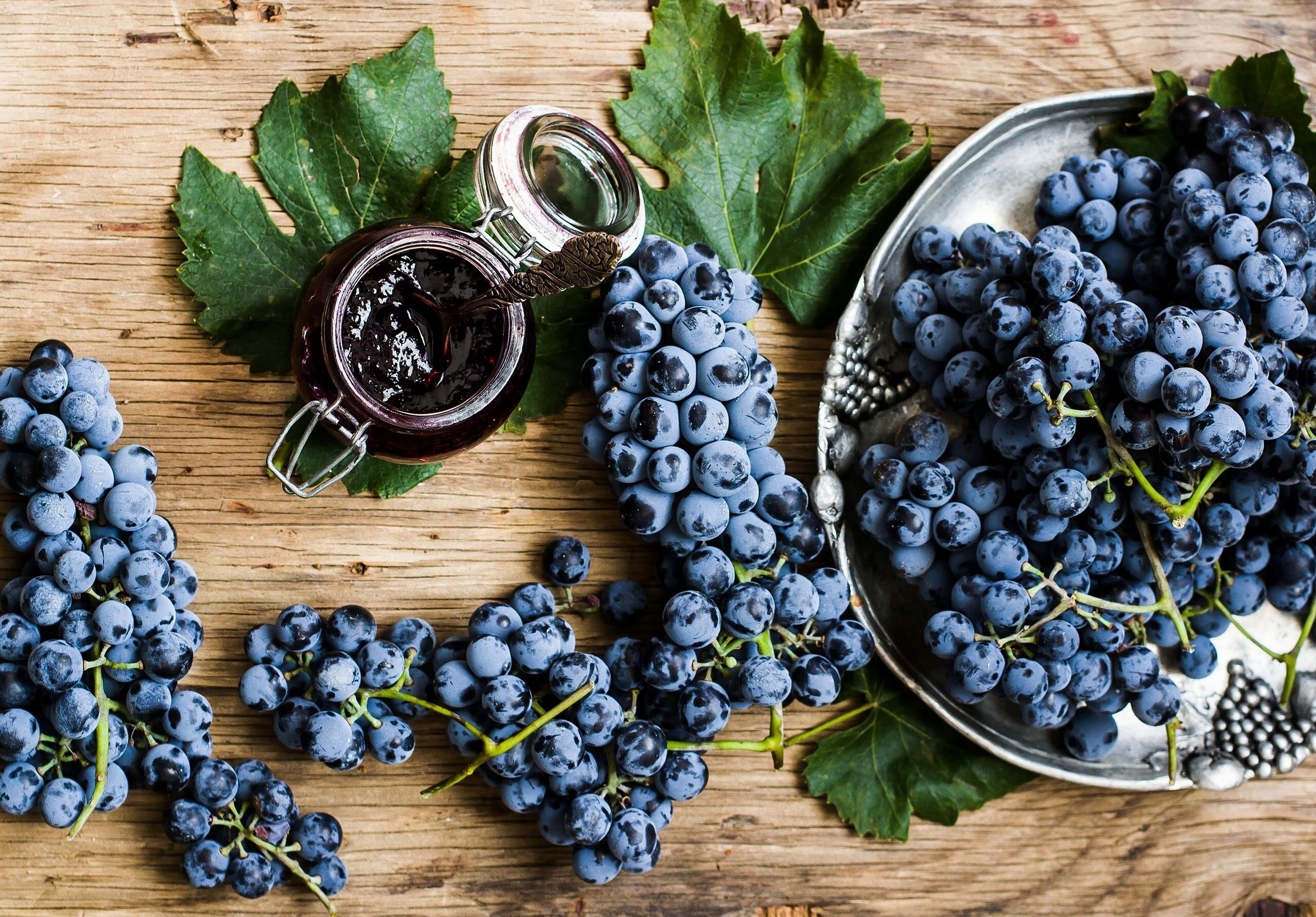 Grapes and grape jam on a wooden table HD Wallpaper