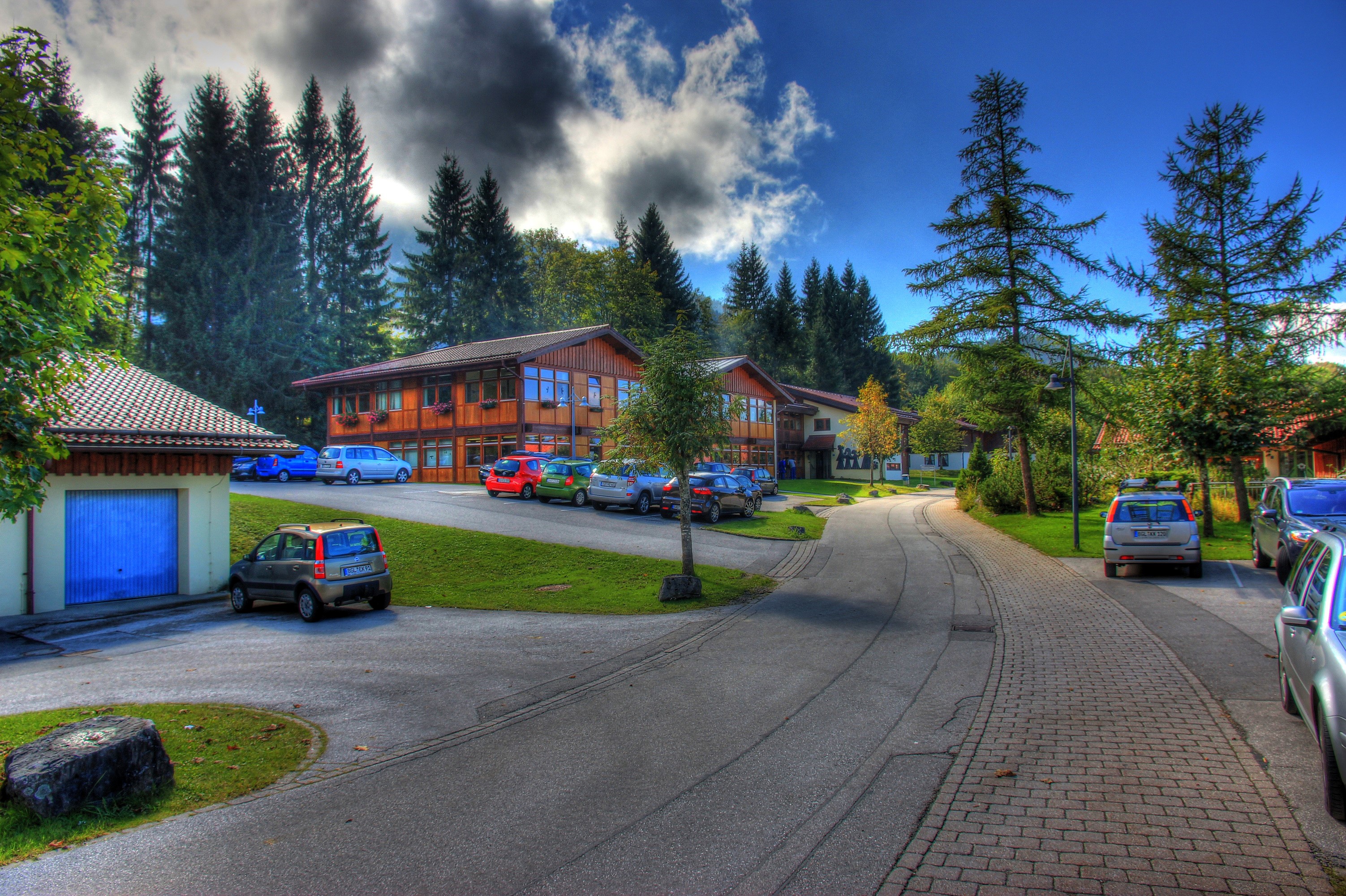 Buildings and cars on a street in Berchtesgaden, Germany HD Wallpaper