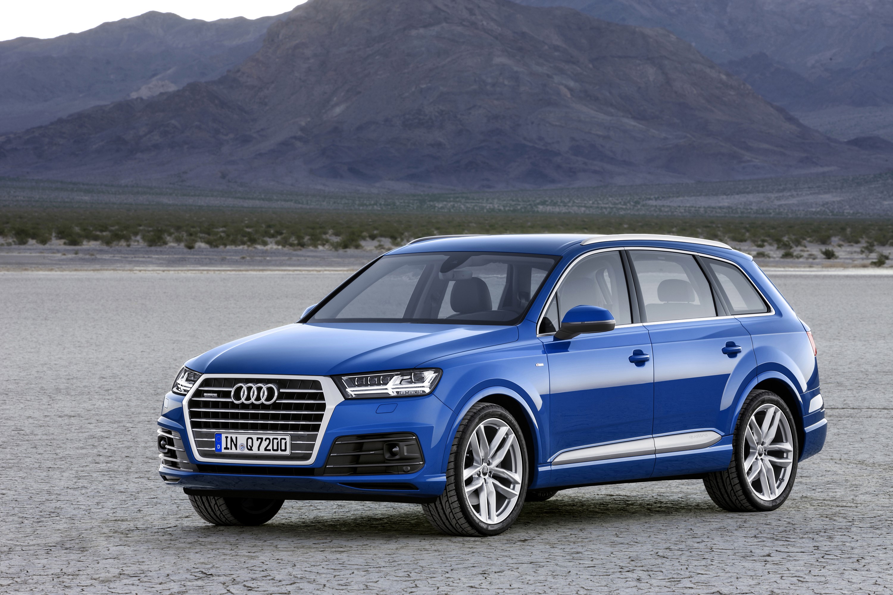 Blue Audi Q7 TFSI quattro in a desert landscape HD Wallpaper