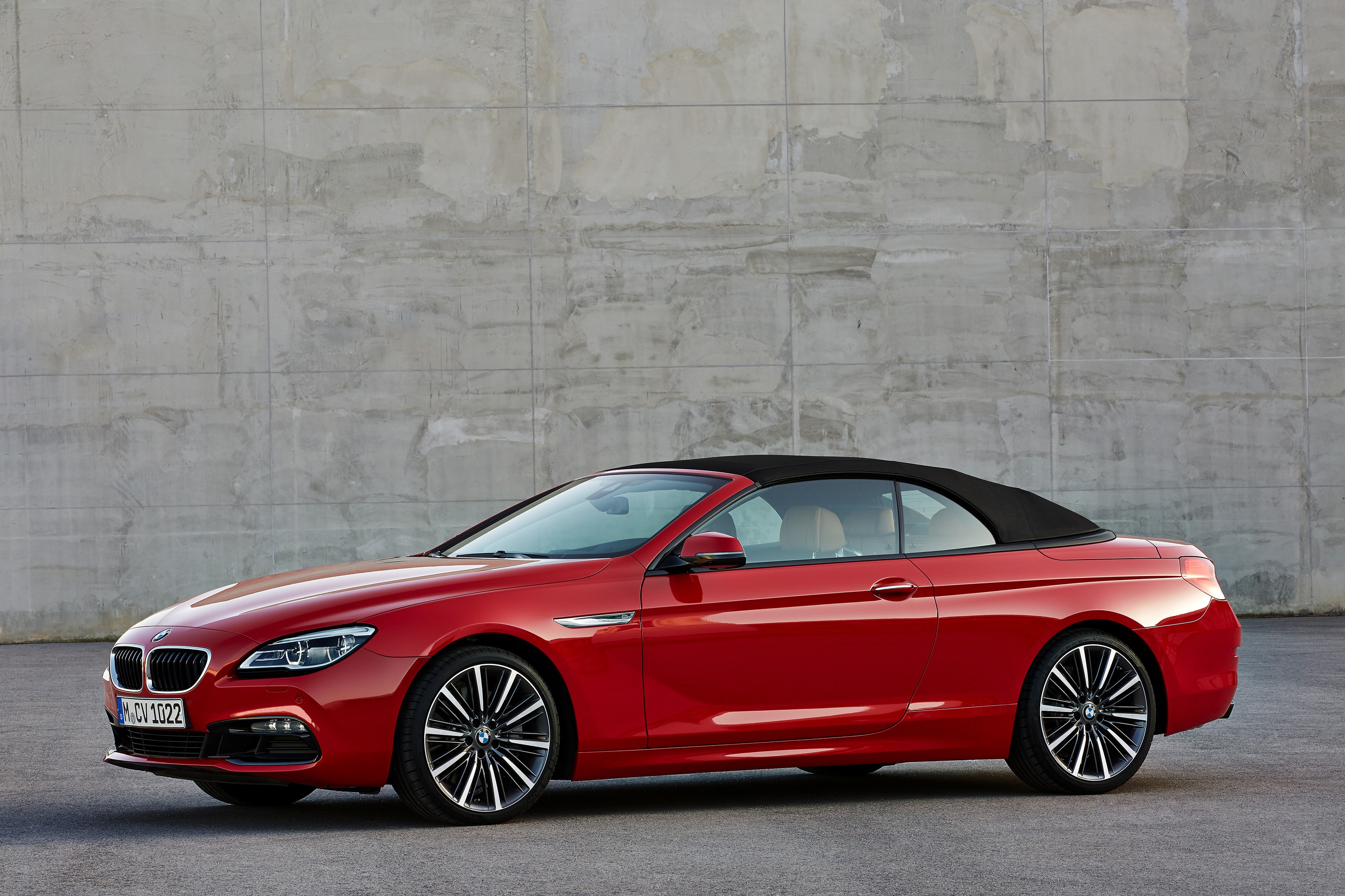 Red BMW M6 Convertible parked in front of a concrete wall HD Wallpaper