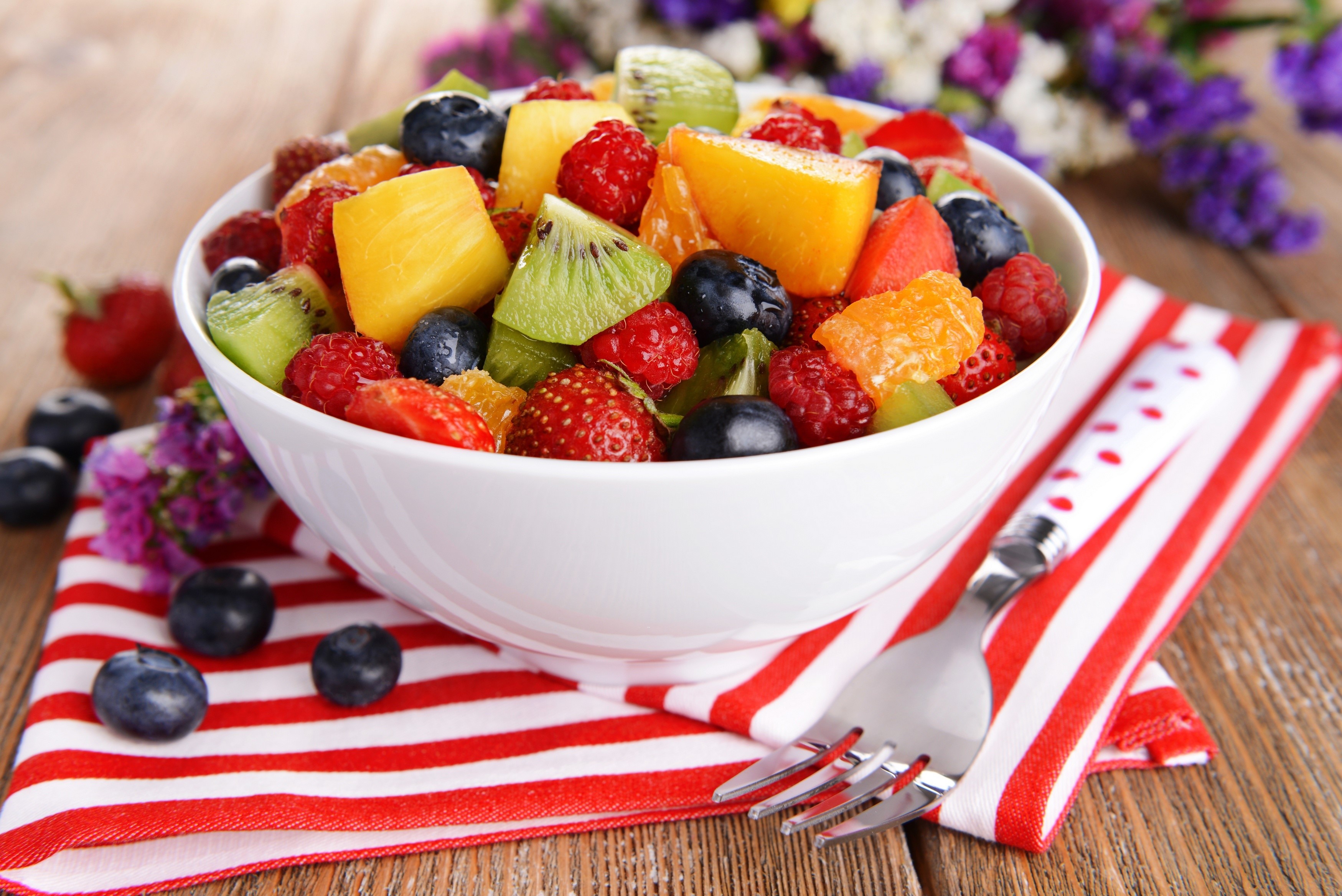 Fruit salad with strawberries, raspberries, kiwi, blueberries, and oranges HD Wallpaper