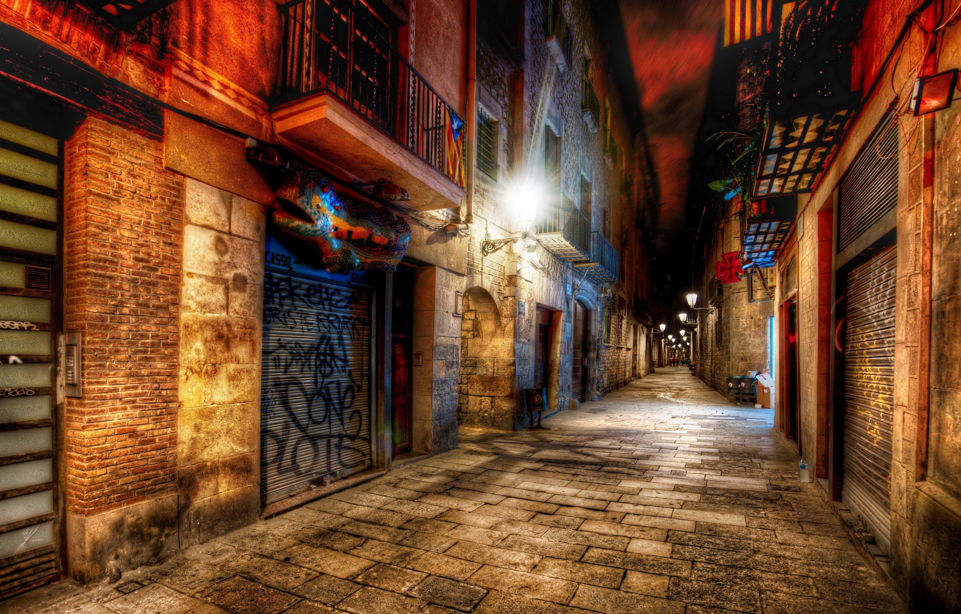 Nighttime street in Barcelona with graffiti and street lights HD Wallpaper