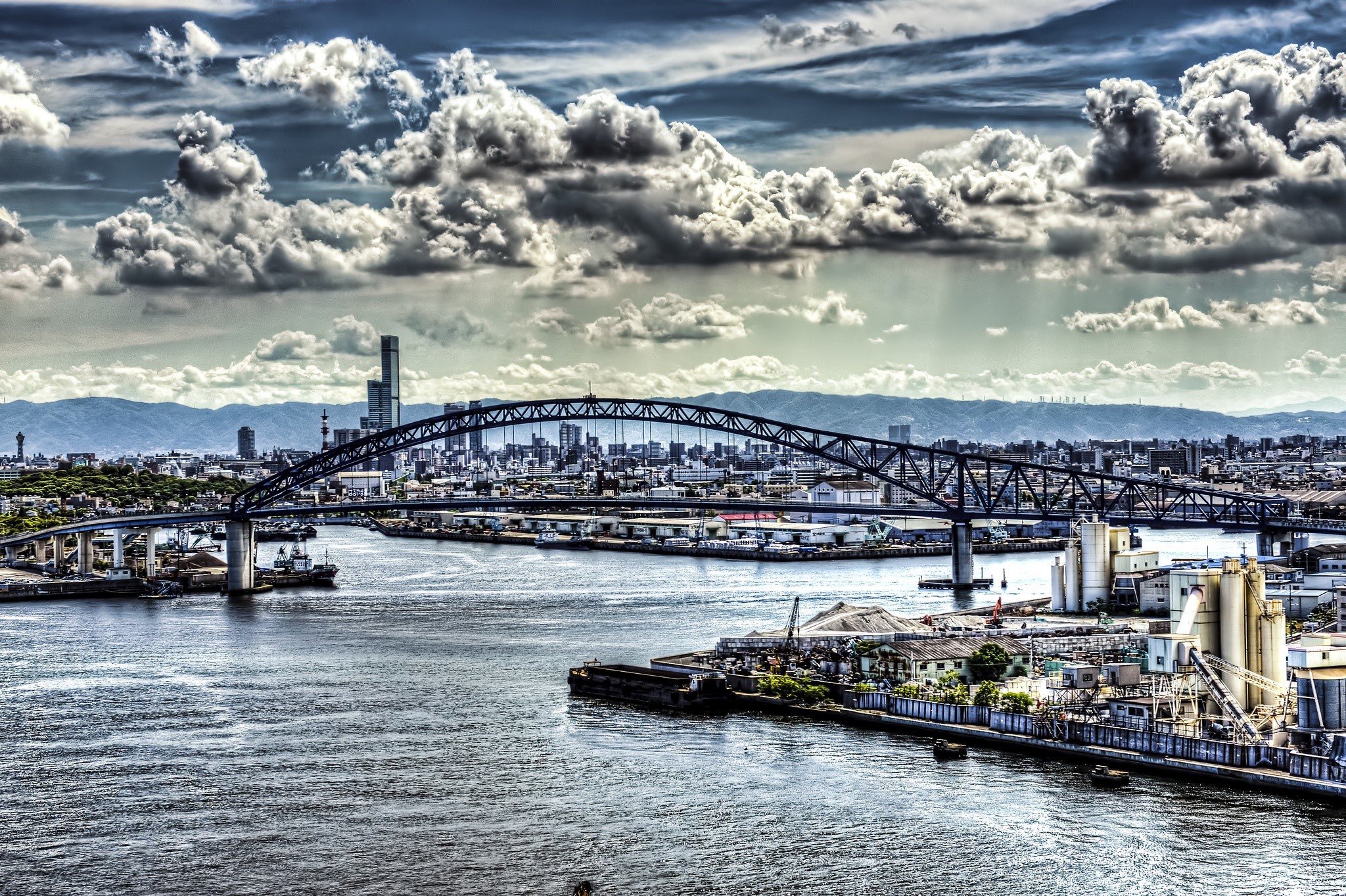 Bridge over water in Japan with city and mountains HD Wallpaper