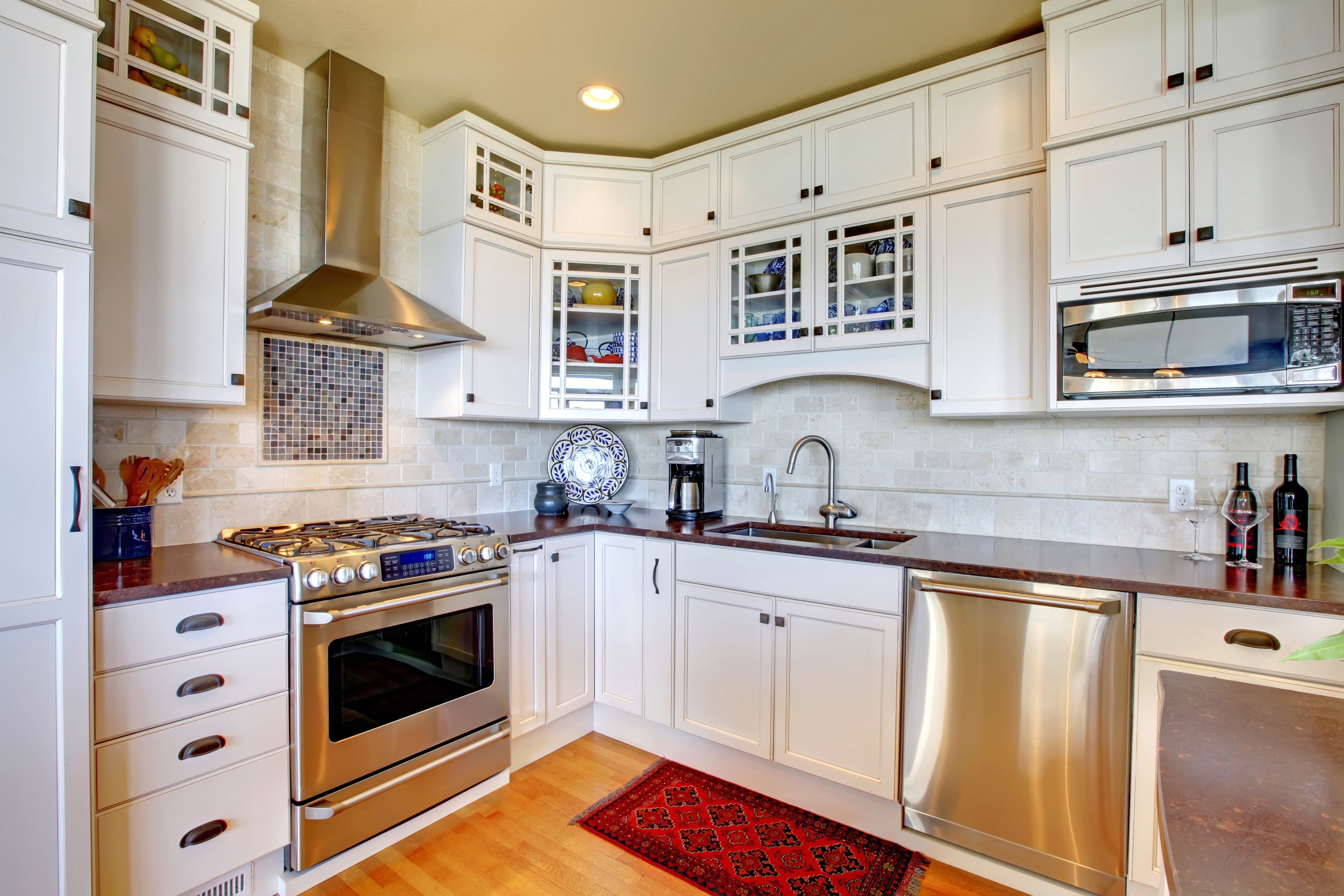 Modern white kitchen with stainless steel appliances HD Wallpaper