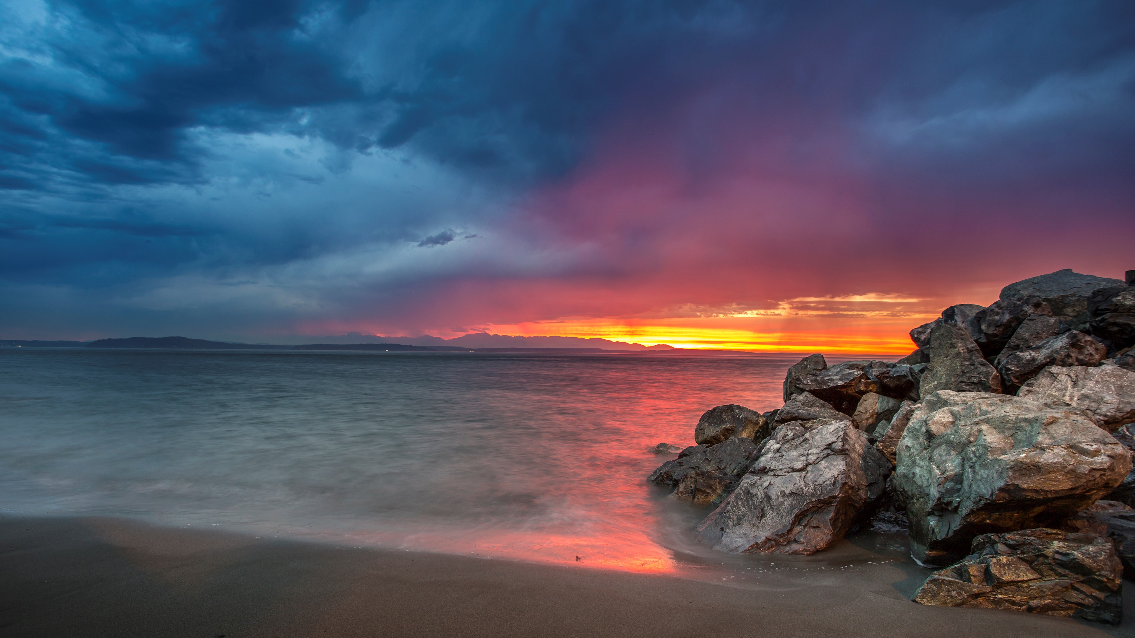 Sunset over the ocean with rocky shore HD Wallpaper