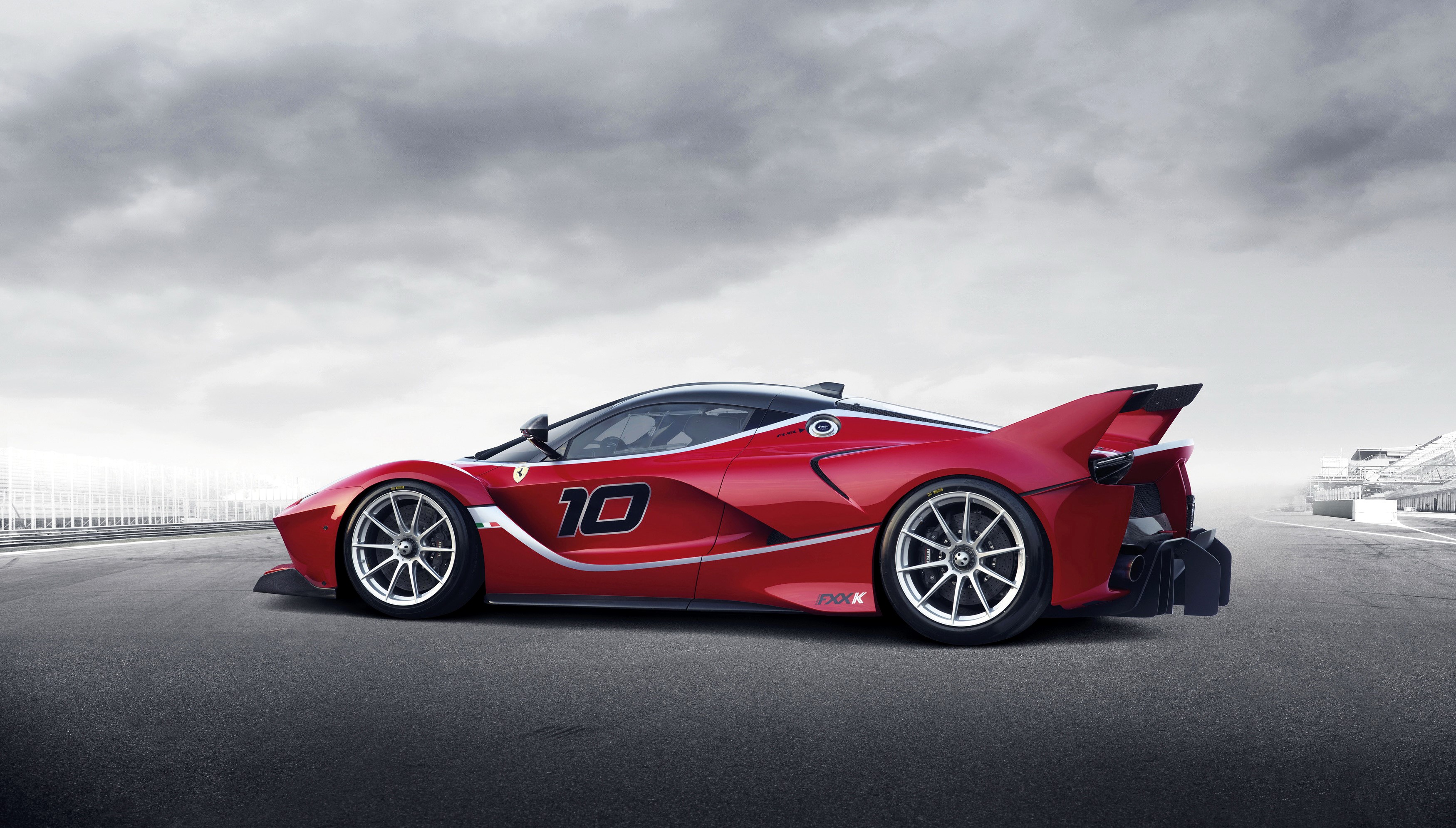 Ferrari FXX K race car on a track HD Wallpaper