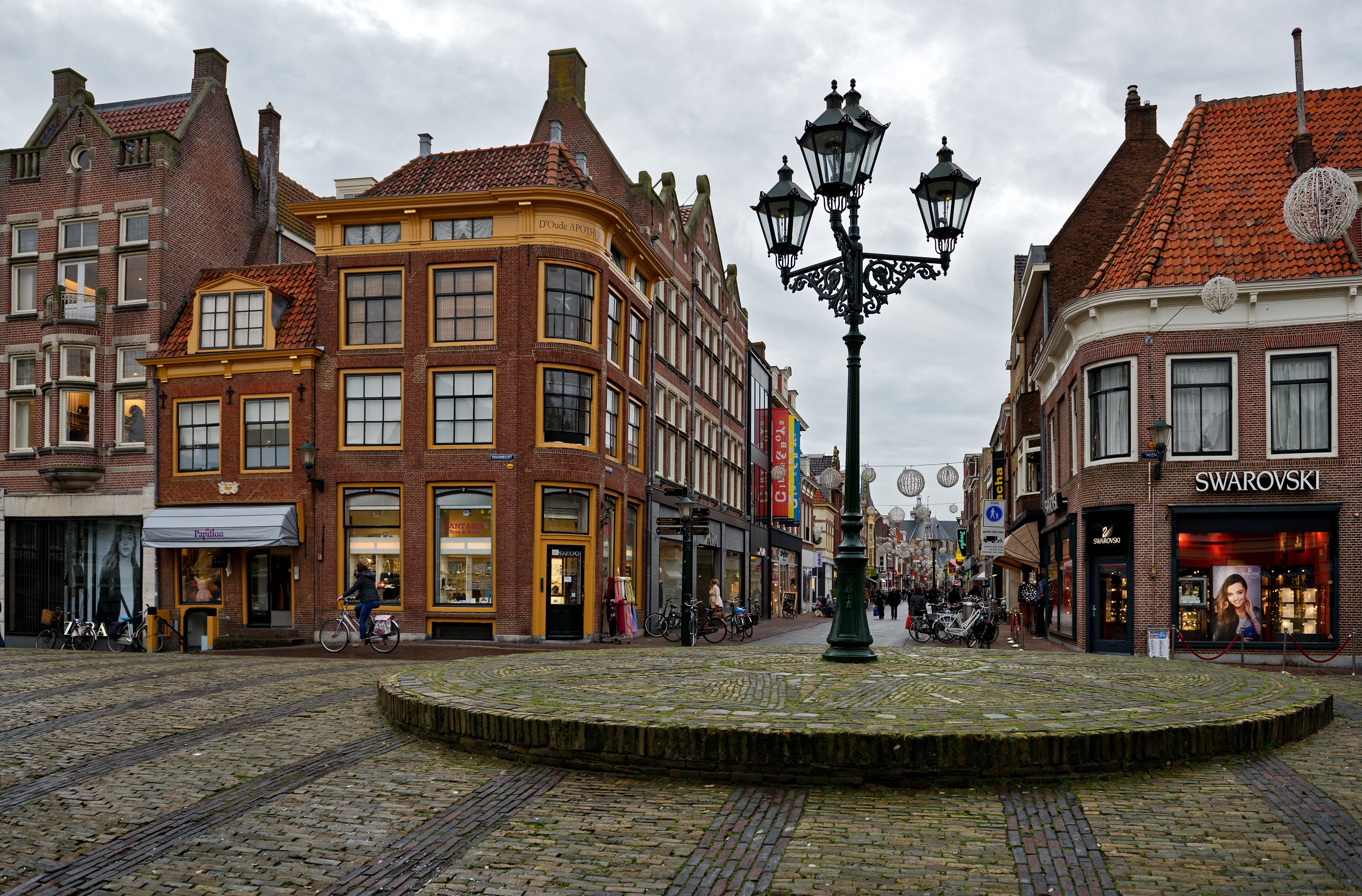 Street scene in Alkmaar, Netherlands with historic buildings and street lights HD Wallpaper