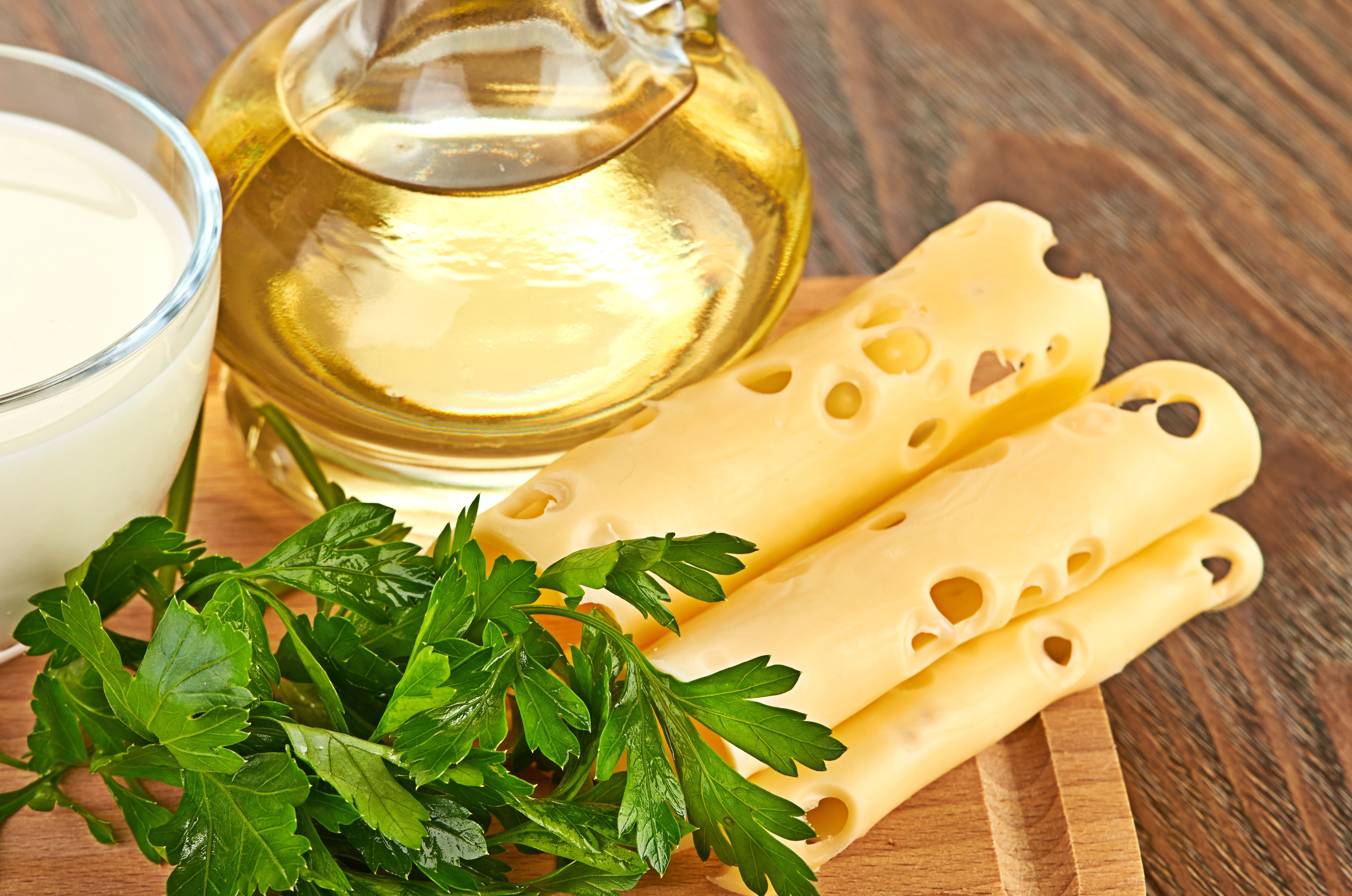 Cheese slices, oil, milk, and parsley HD Wallpaper