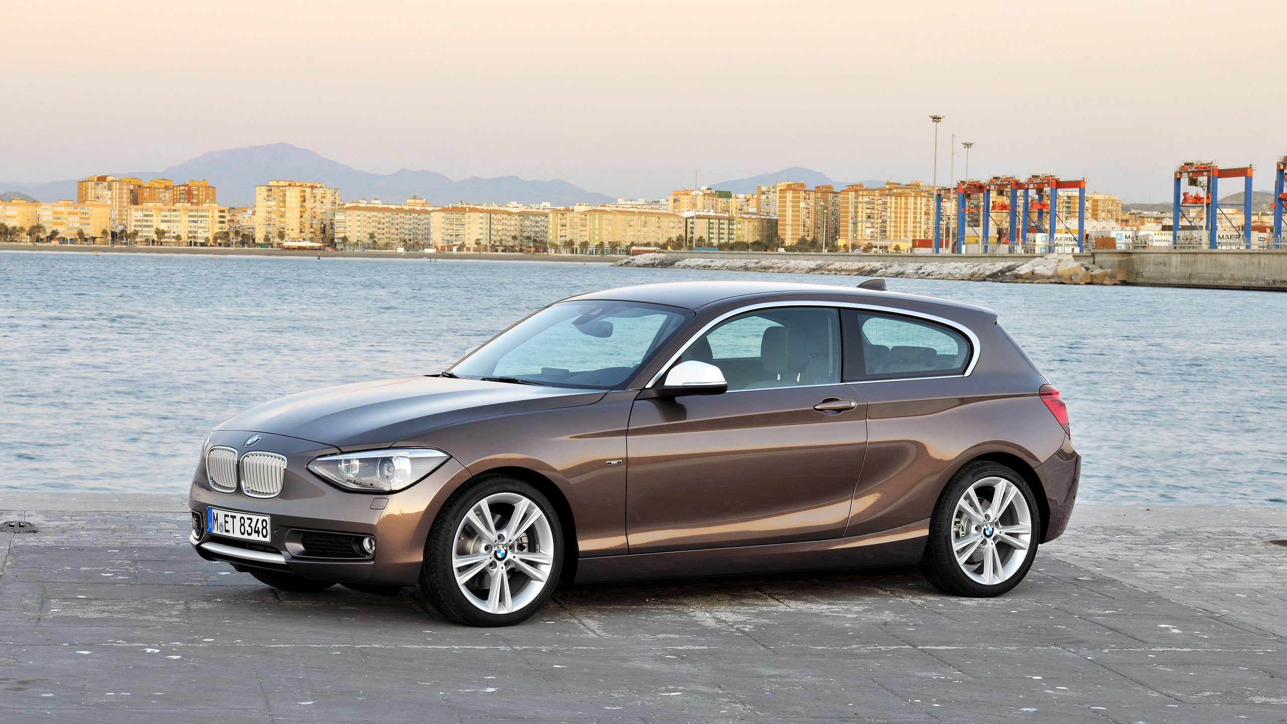 BMW 1 Series 3-door parked by the water HD Wallpaper