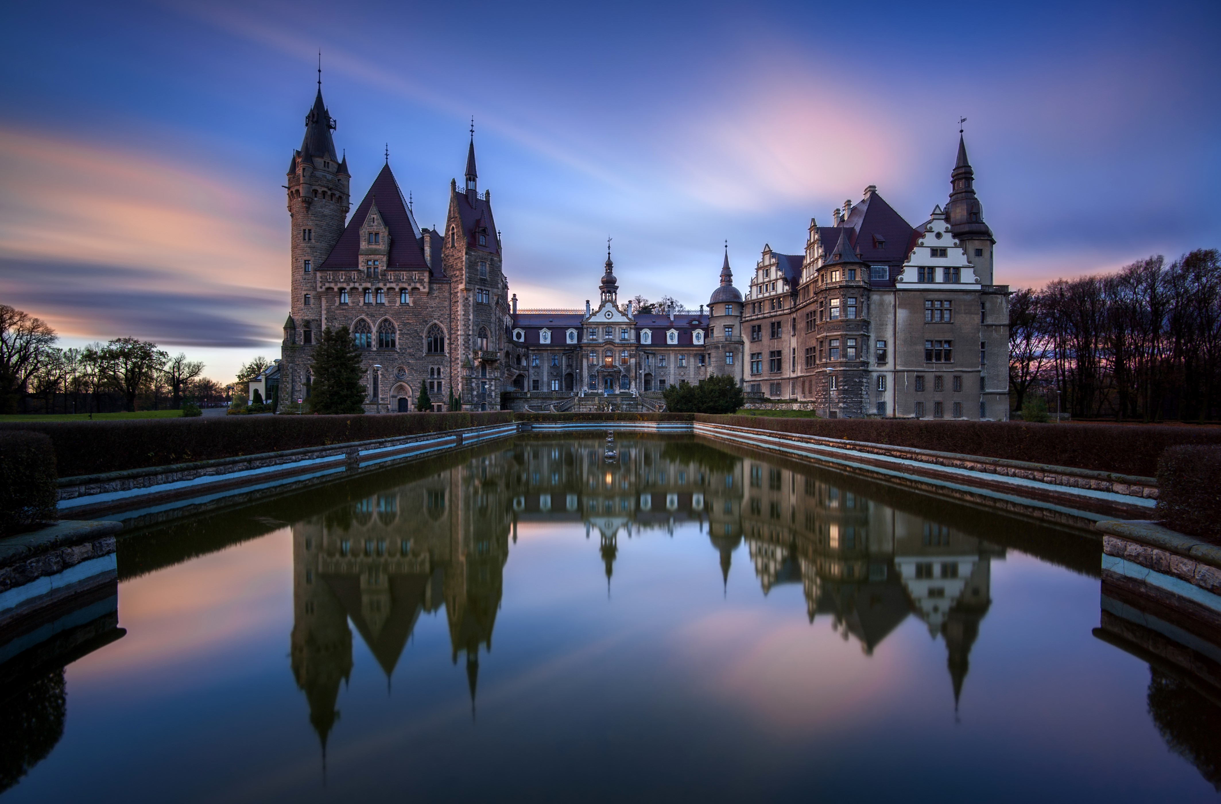Moszna Castle reflected in pond at sunset, Poland HD Wallpaper