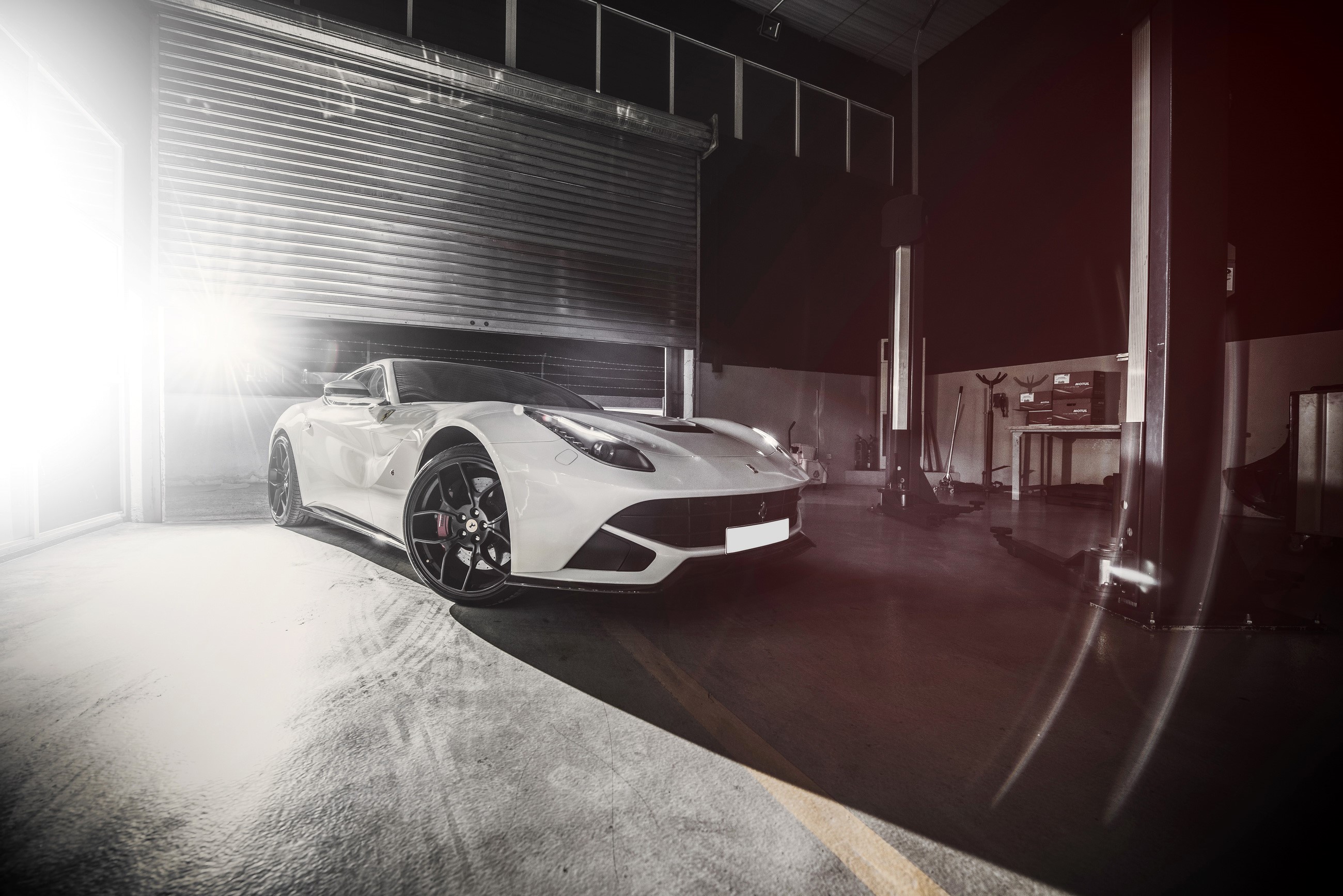White 2014 Ferrari F12berlinetta in a garage HD Wallpaper