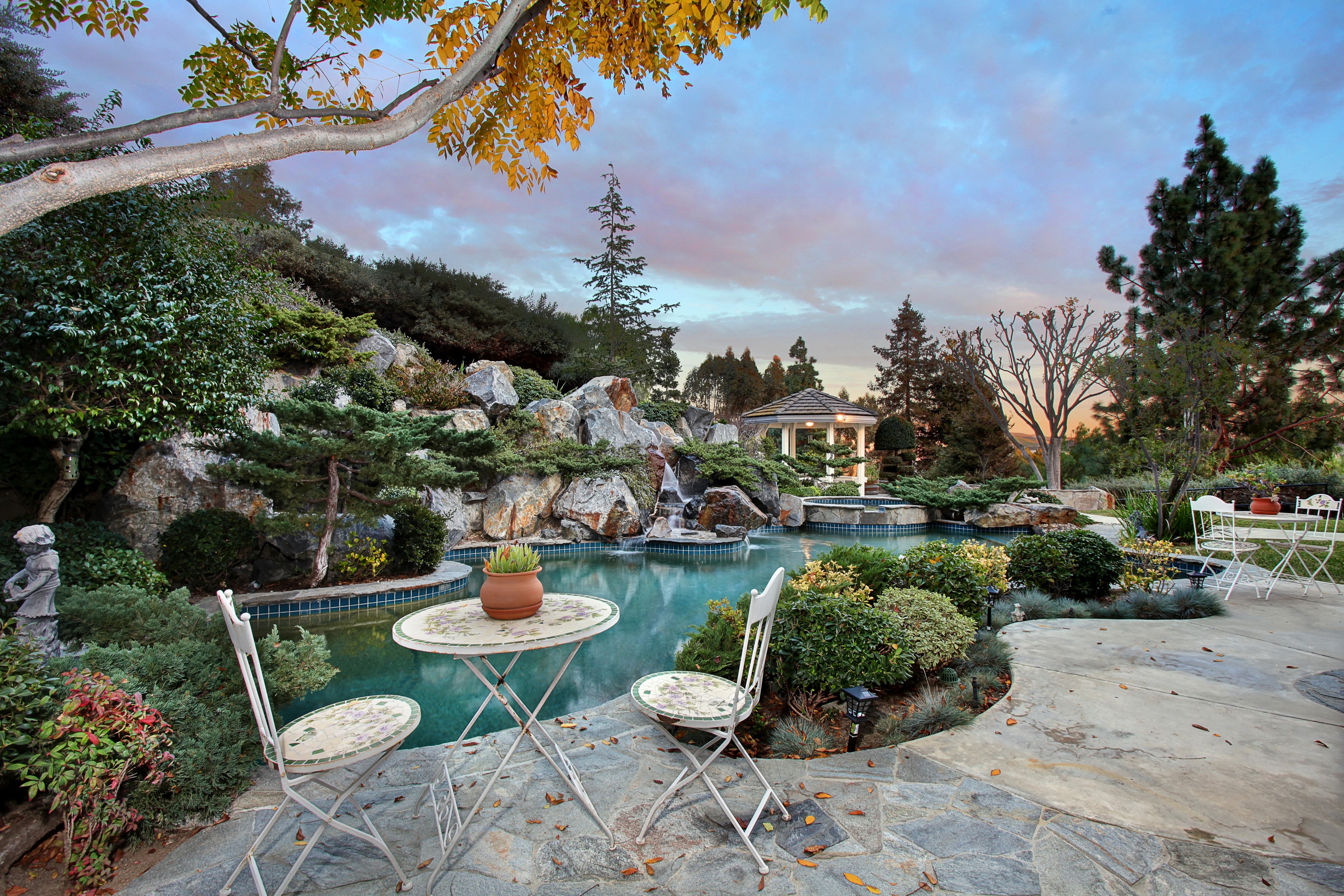 Backyard pool with waterfall and gazebo in San Juan Capistrano HD Wallpaper
