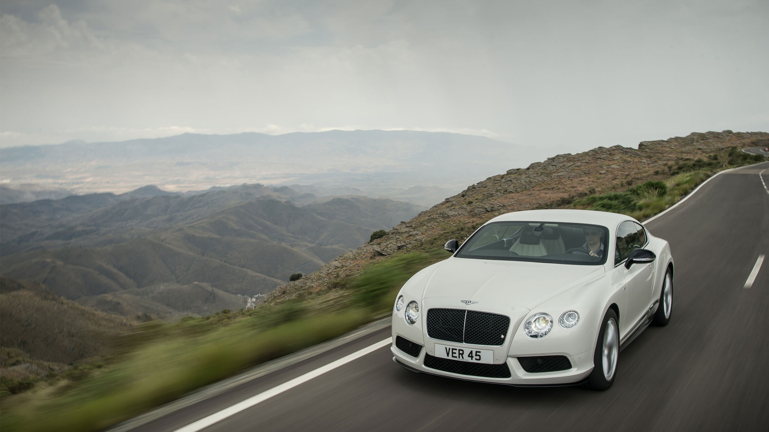 White Bentley Continental GT V8 on a mountain road HD Wallpaper