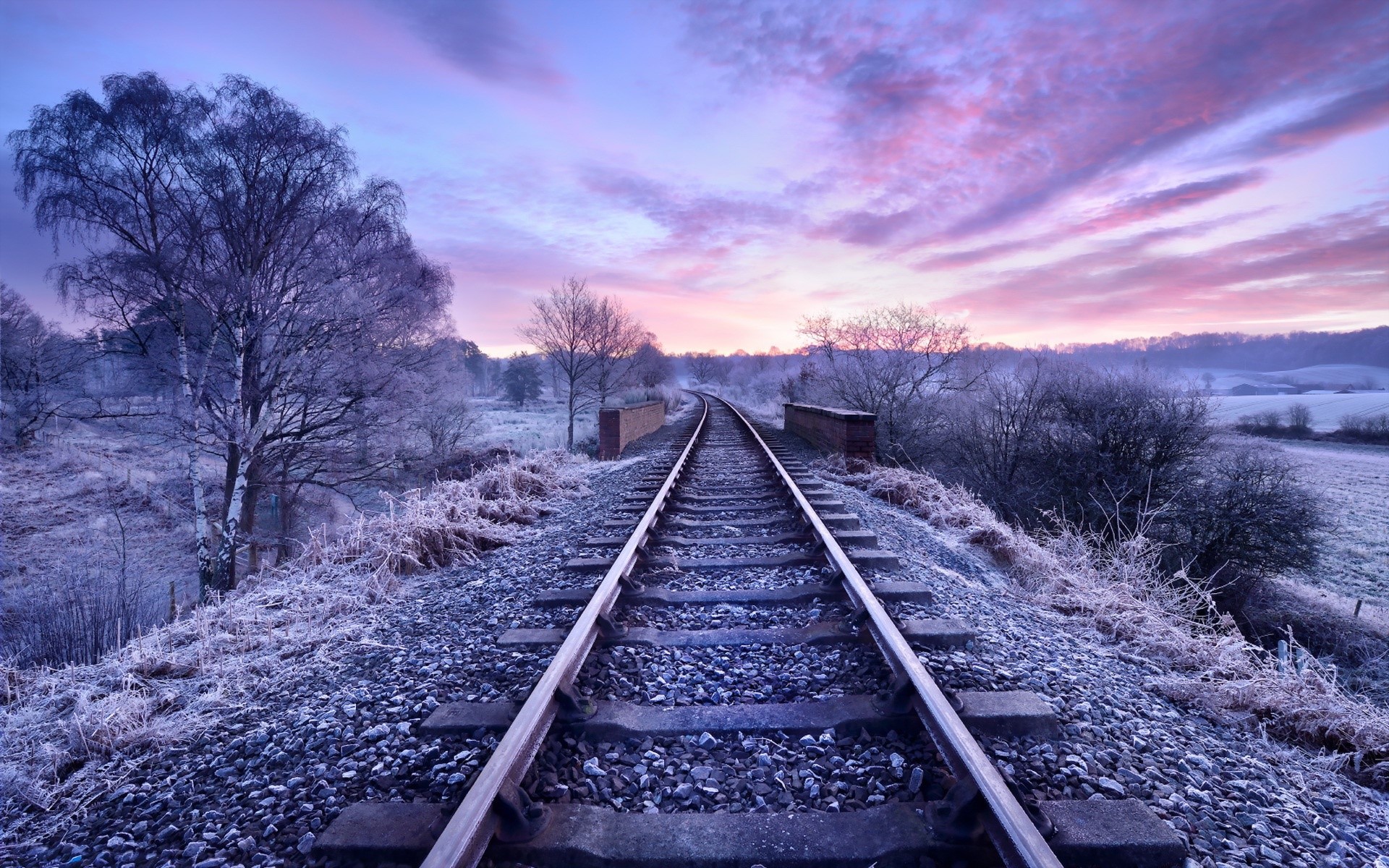 Railroad tracks at sunrise with frosted trees HD Wallpaper