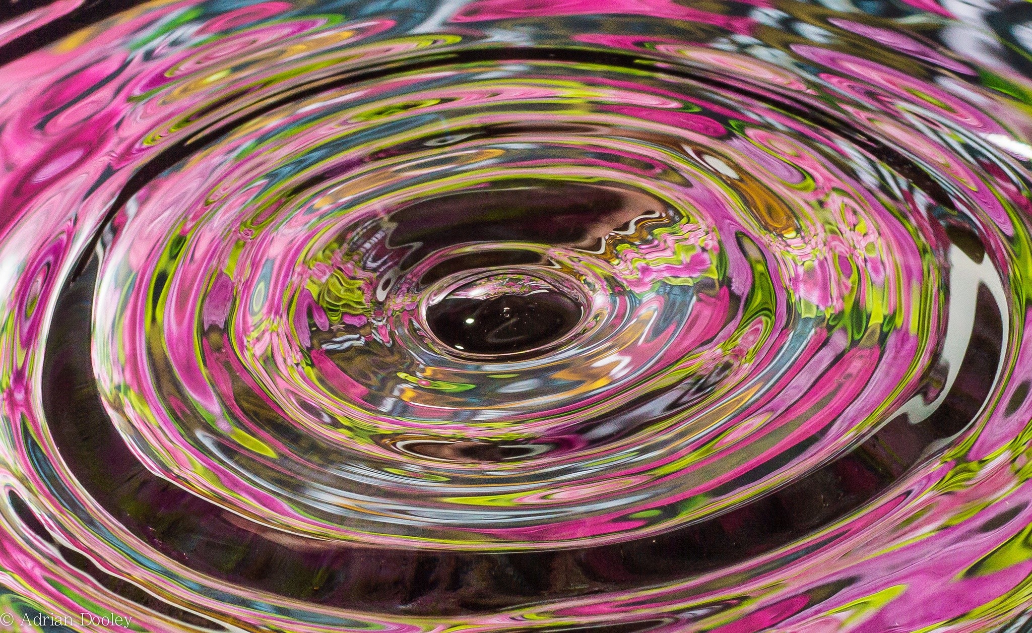 Water ripples with pink and green colors HD Wallpaper