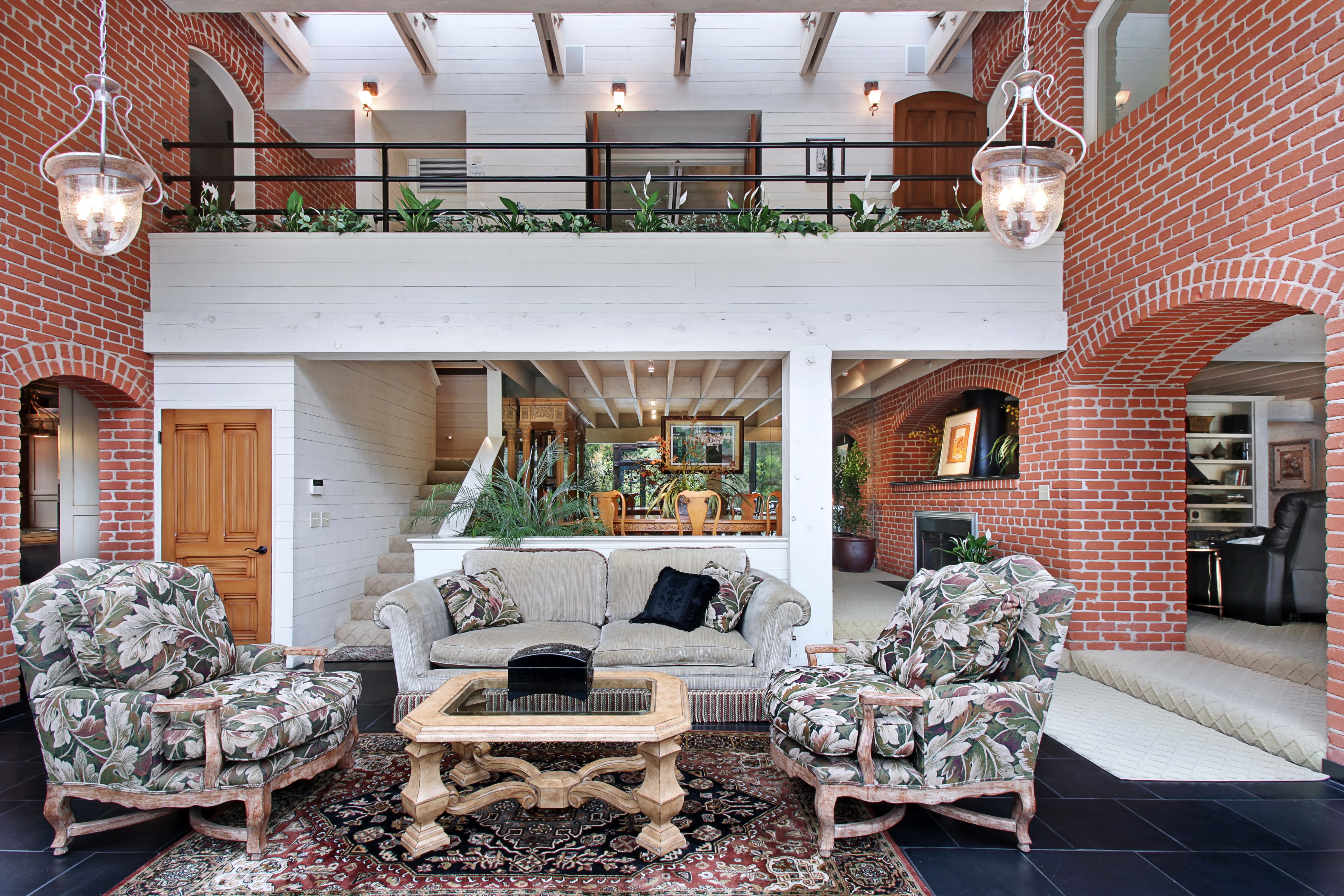 Living room with sofa, armchairs, and table HD Wallpaper