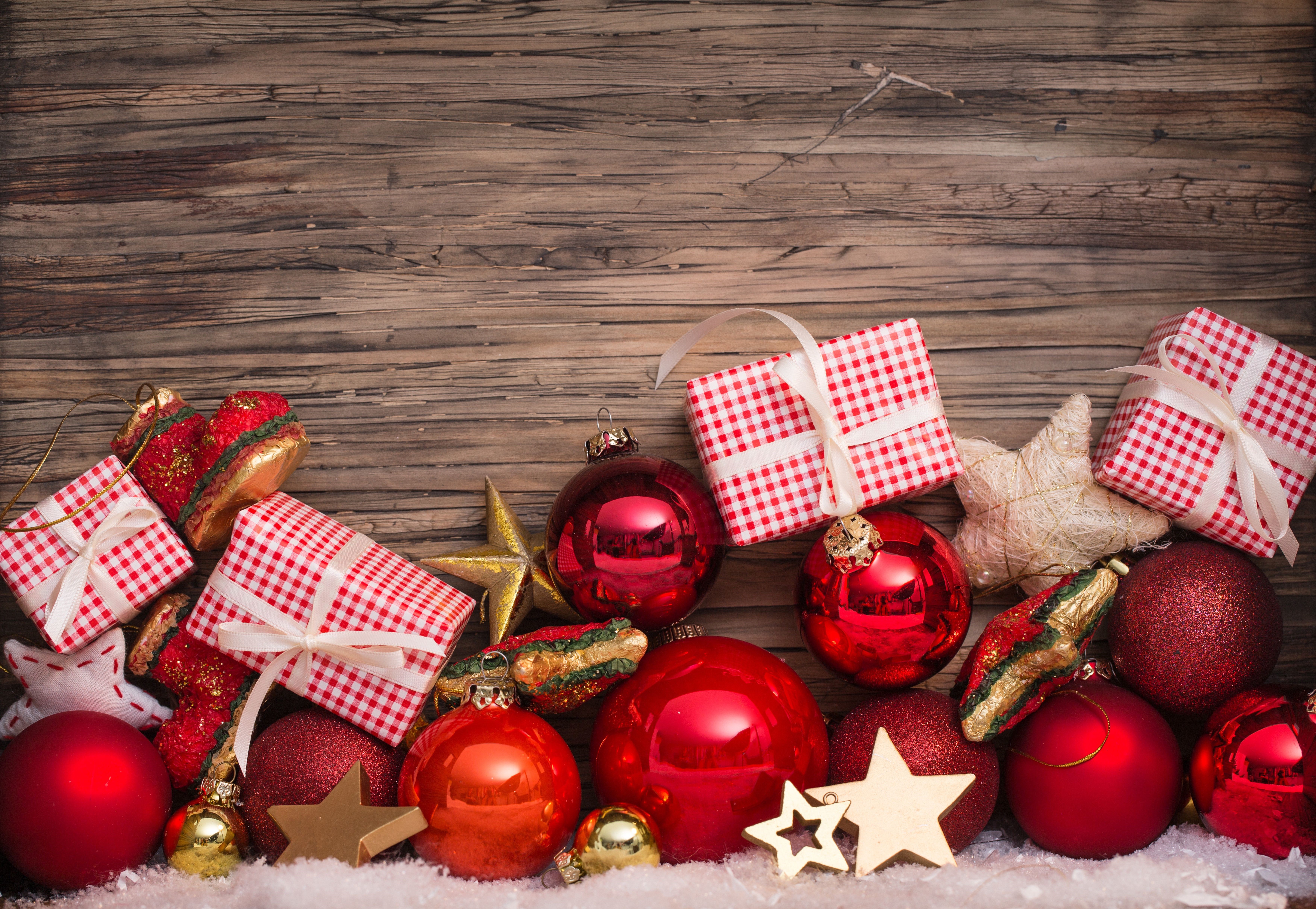 Christmas ornaments and gifts on wooden background HD Wallpaper
