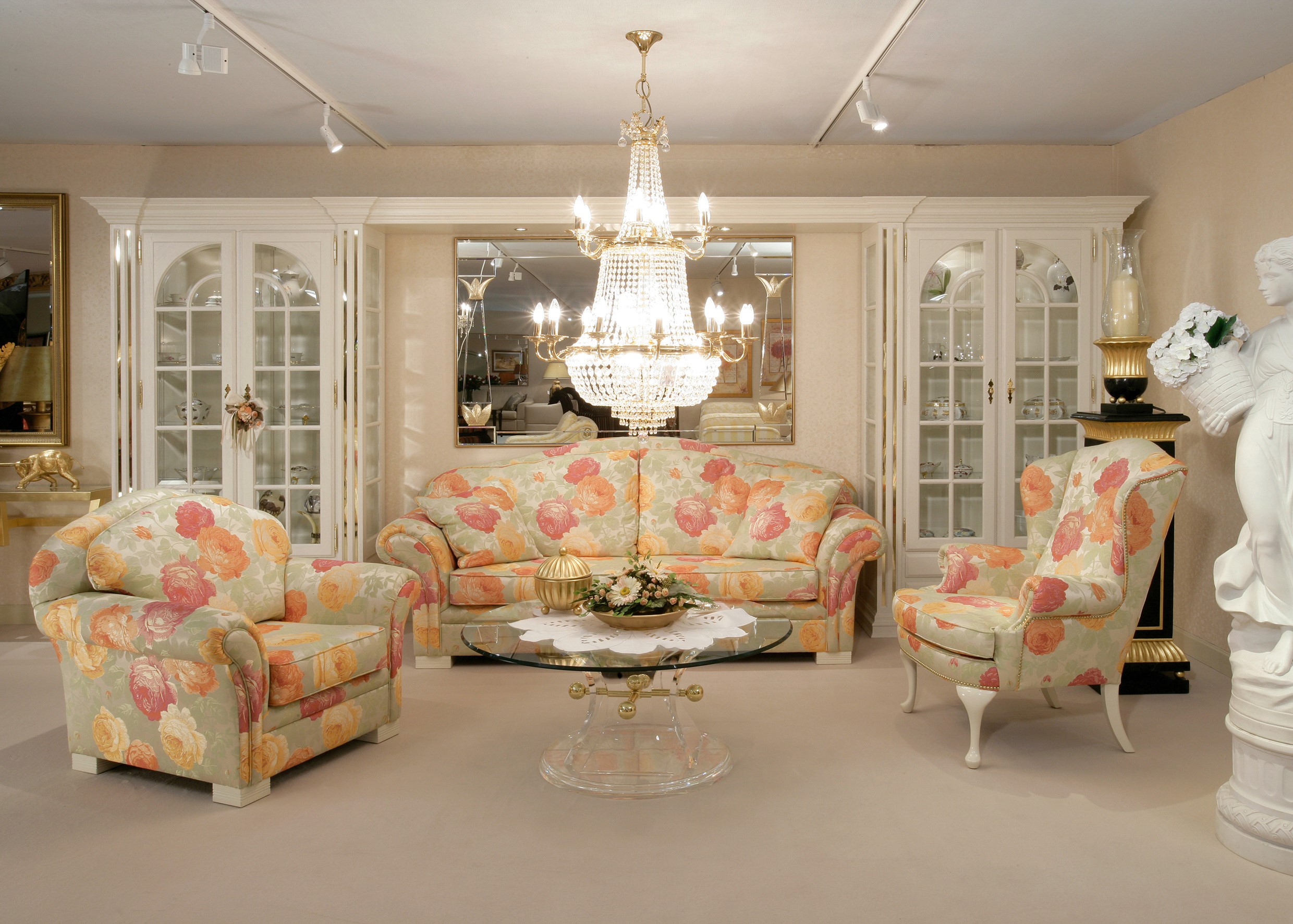 Living room with floral sofa, armchairs, and chandelier HD Wallpaper