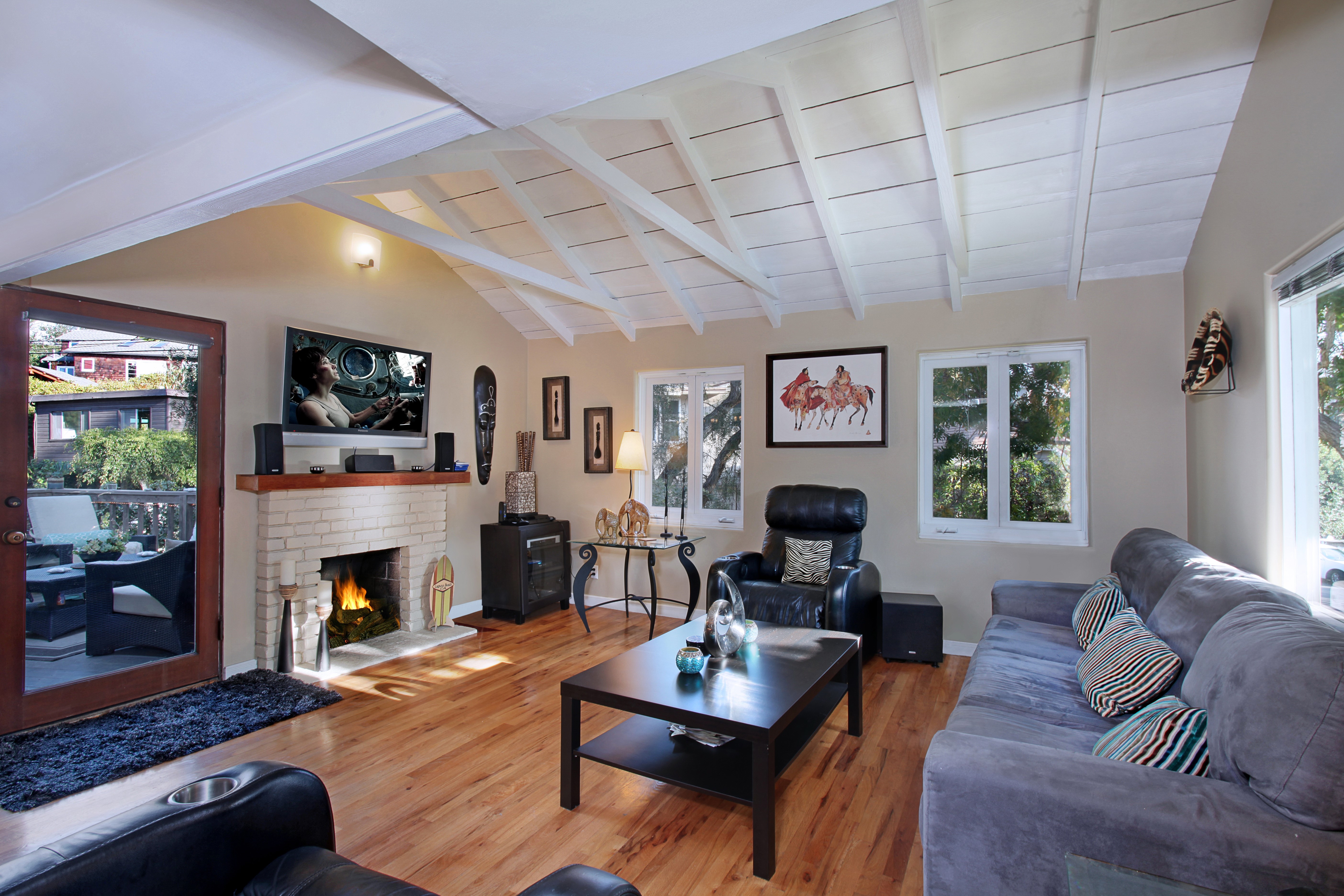 Living room with fireplace and sofa HD Wallpaper