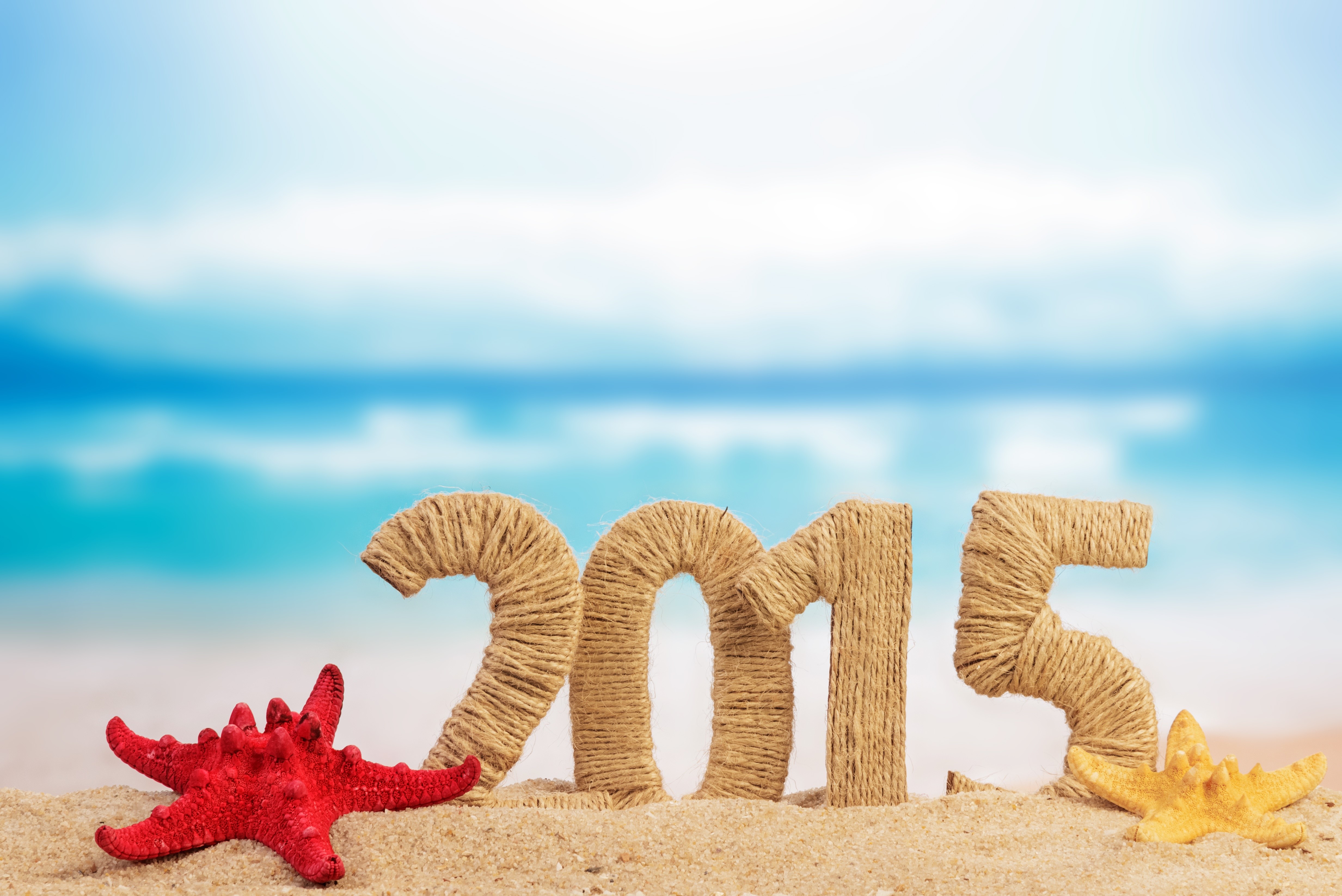 2015 numbers with starfish on beach HD Wallpaper