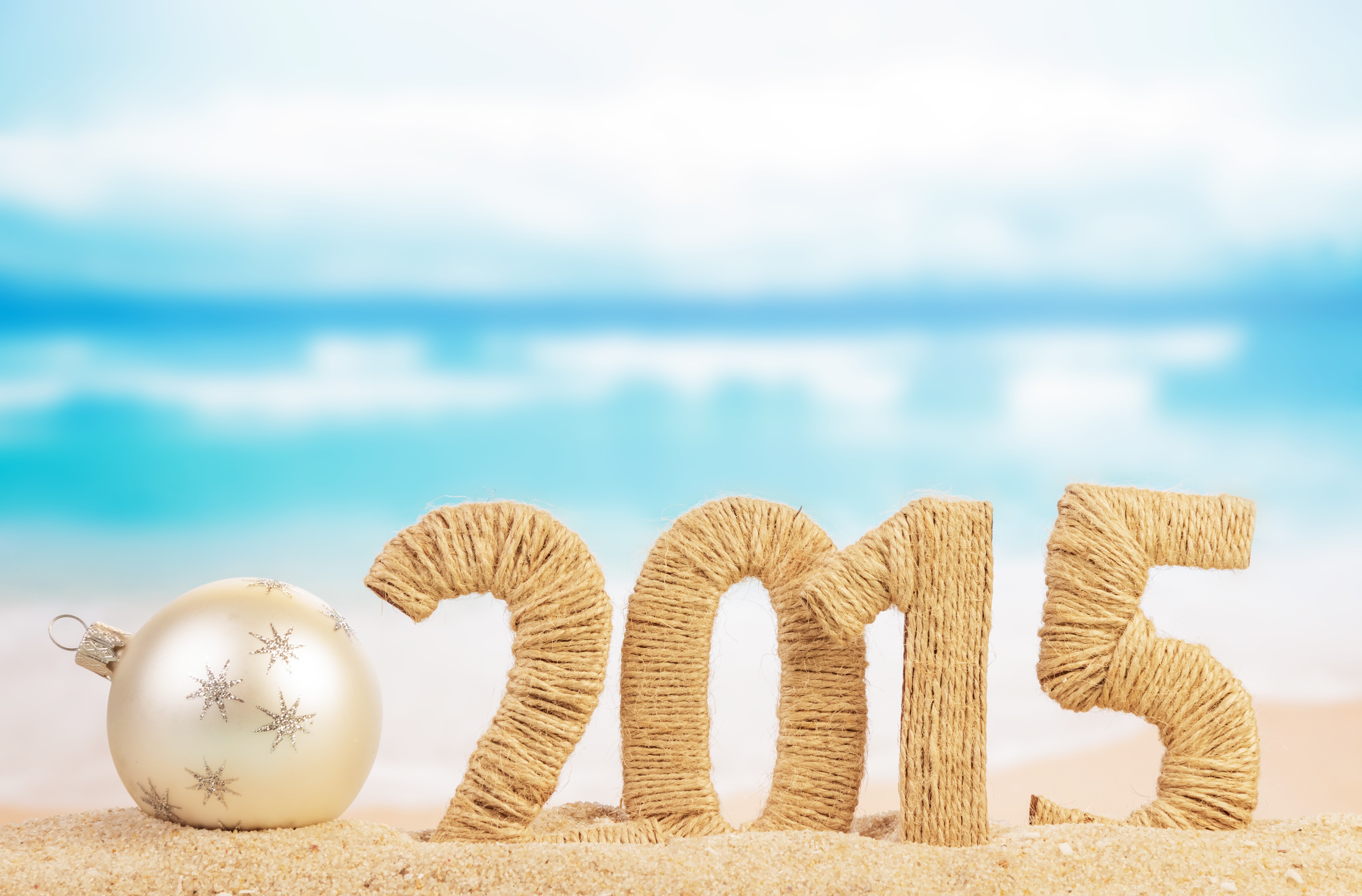 2015 numbers and ornament on a beach HD Wallpaper