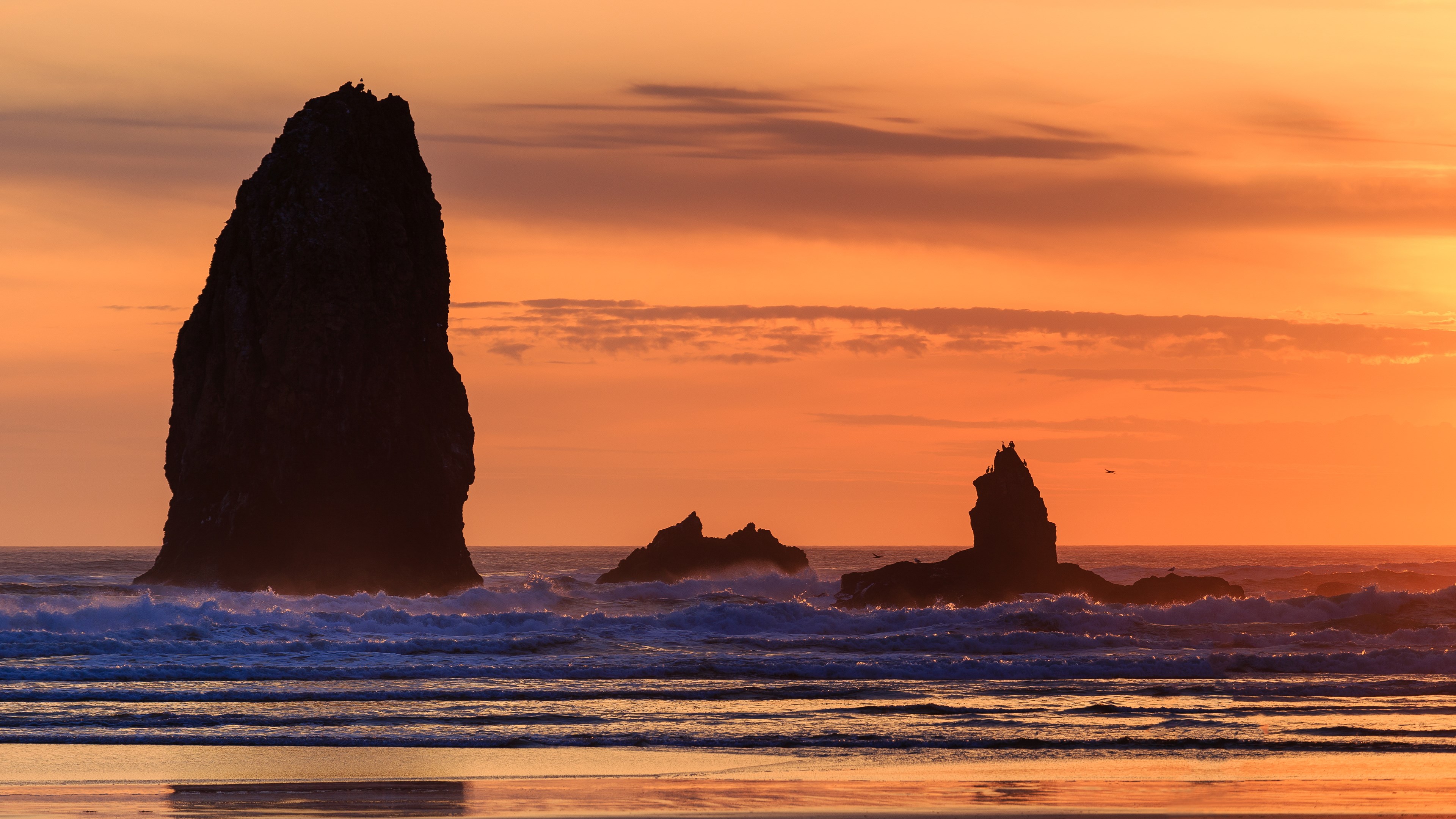 Sea stacks at sunset with waves crashing HD Wallpaper