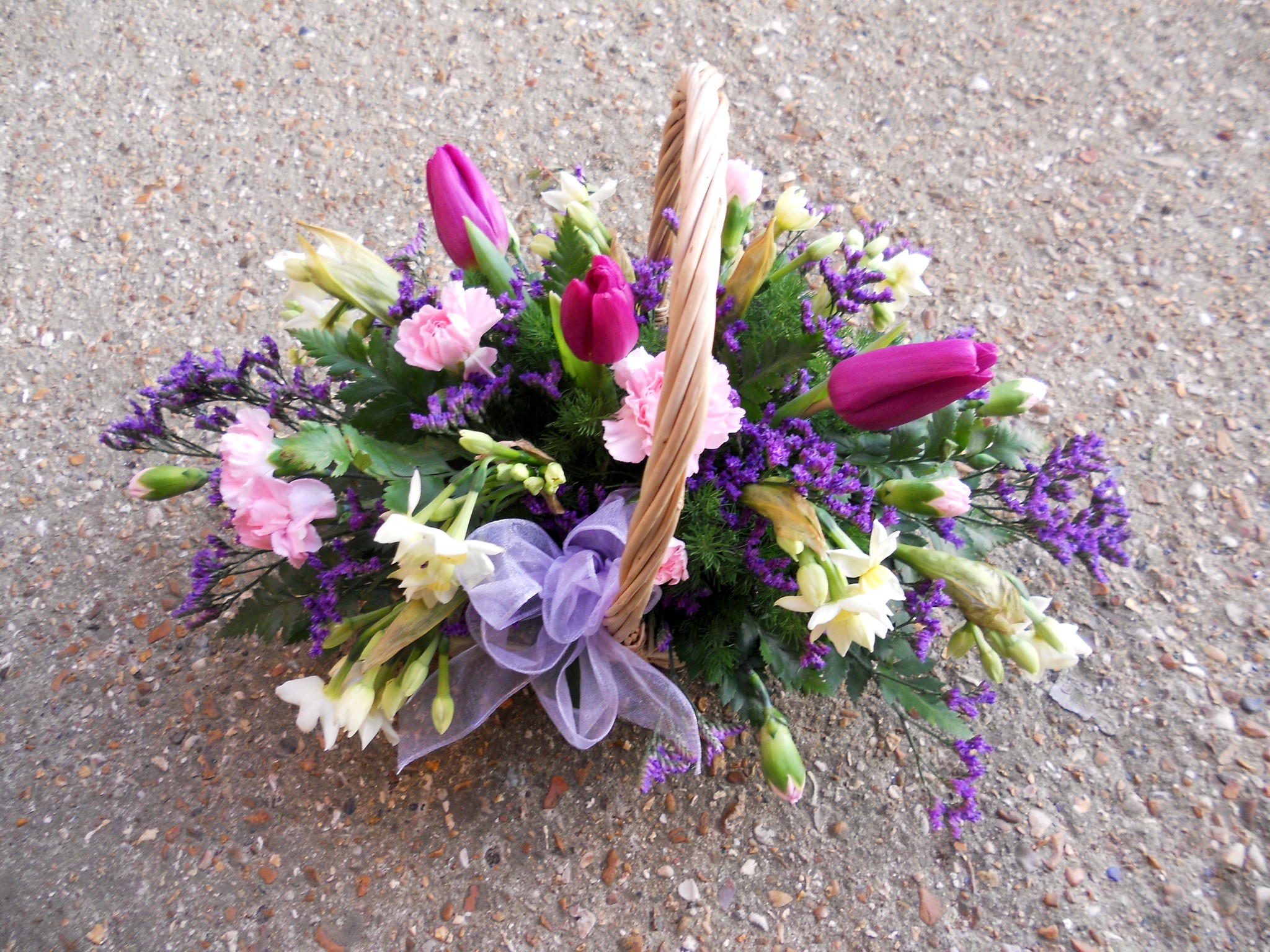 Flower basket with tulips, carnations, and daffodils HD Wallpaper
