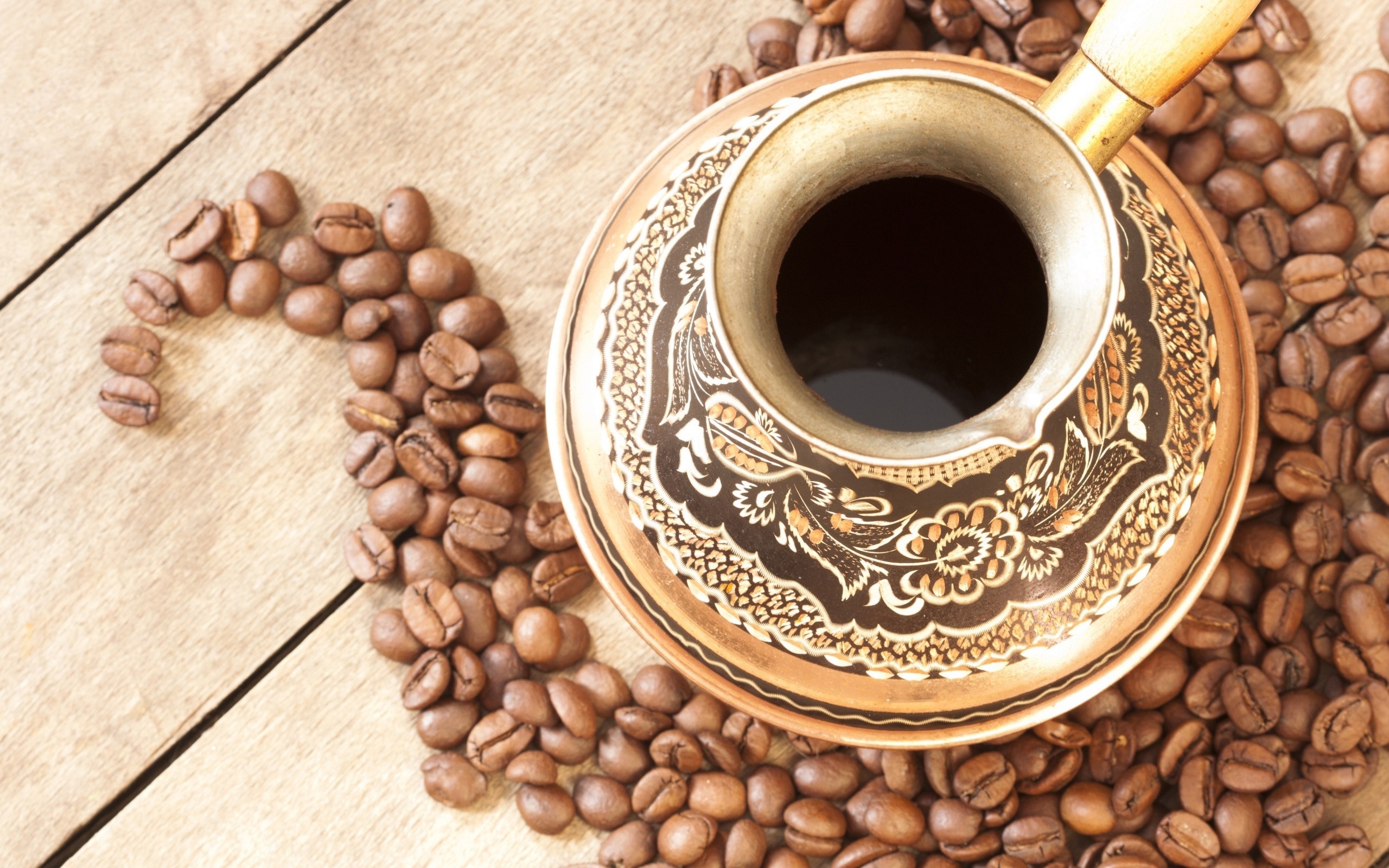 Coffee beans and a cezve on a wooden table HD Wallpaper