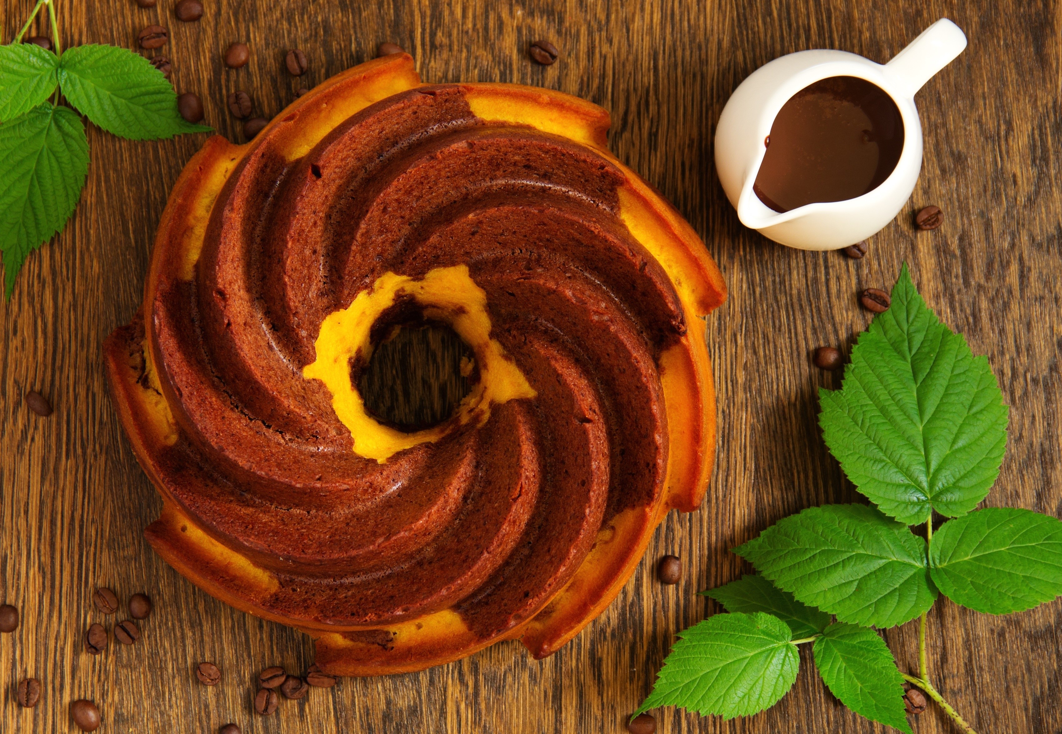 Bundt cake with chocolate sauce and coffee beans HD Wallpaper