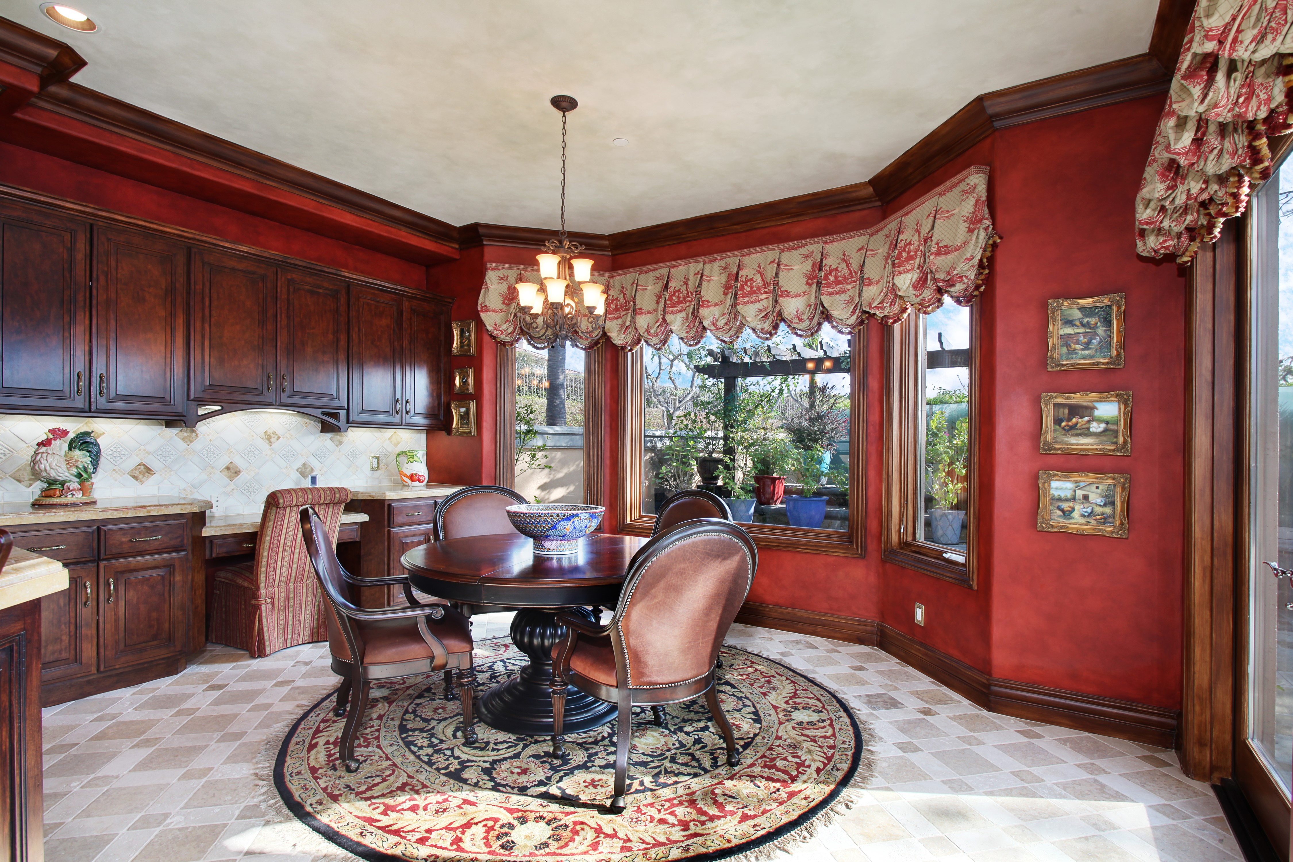 Dining room with red walls and dark wood cabinets HD Wallpaper
