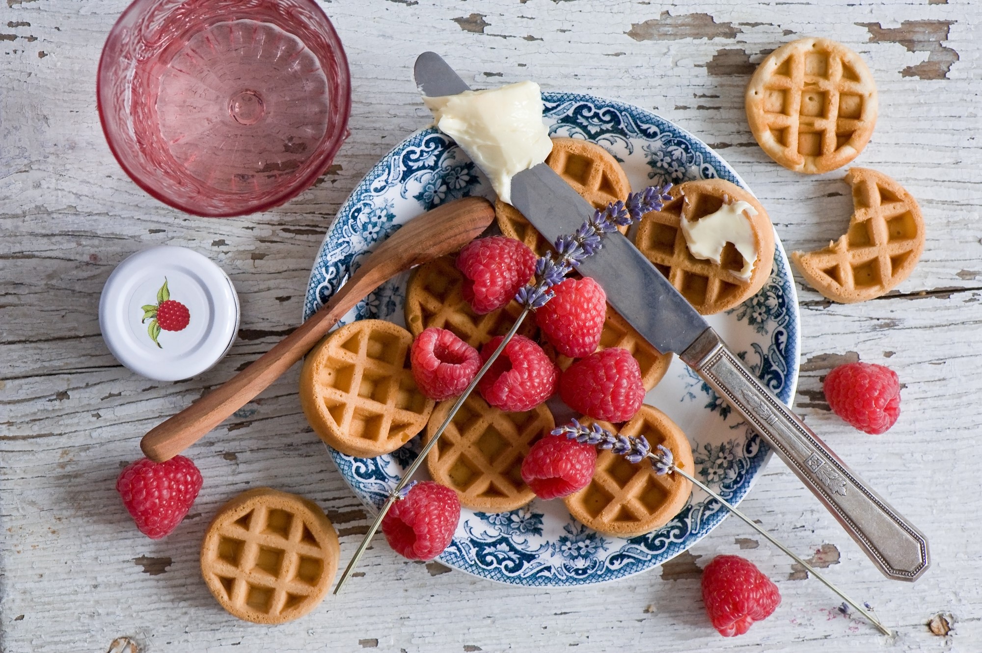 Waffles with raspberries, butter, and lavender on a plate HD Wallpaper