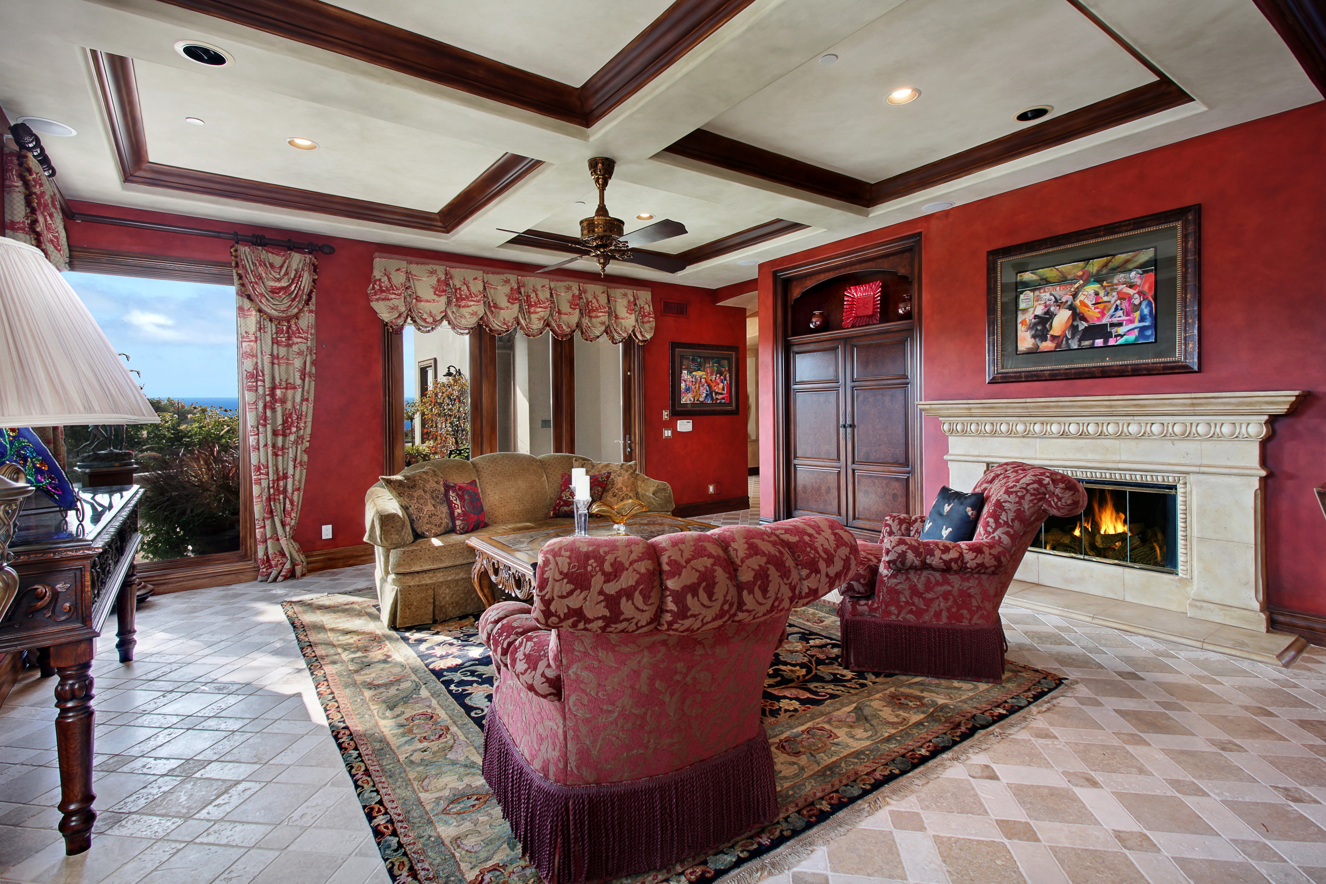 Living room with fireplace and armchair HD Wallpaper