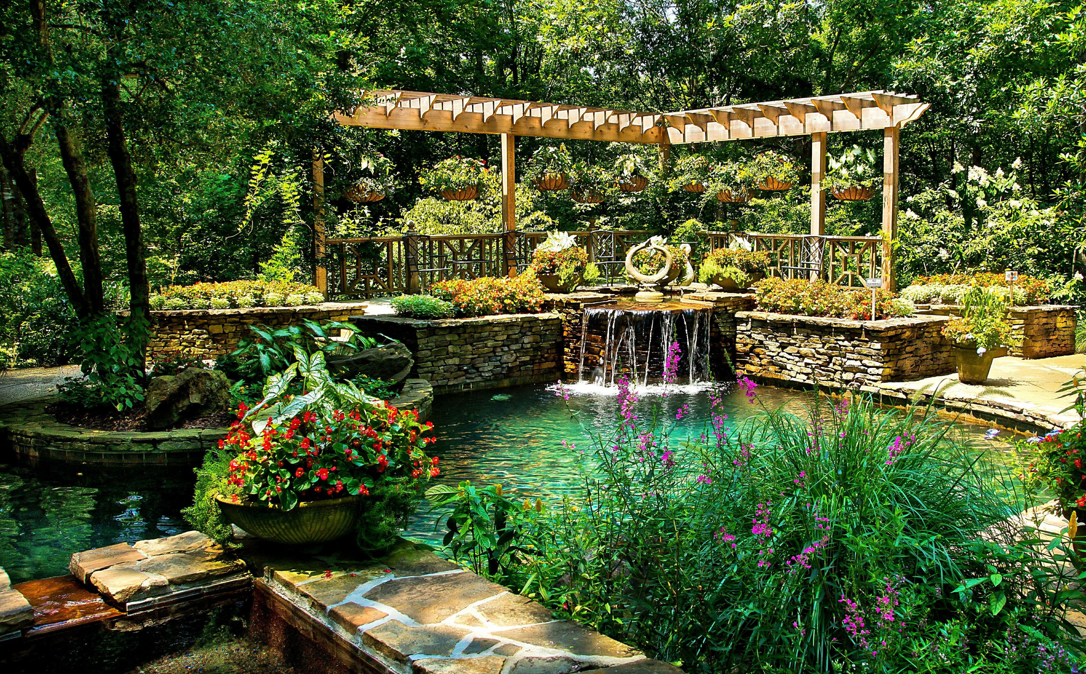 Gibbs Gardens pond with waterfall and pergola HD Wallpaper