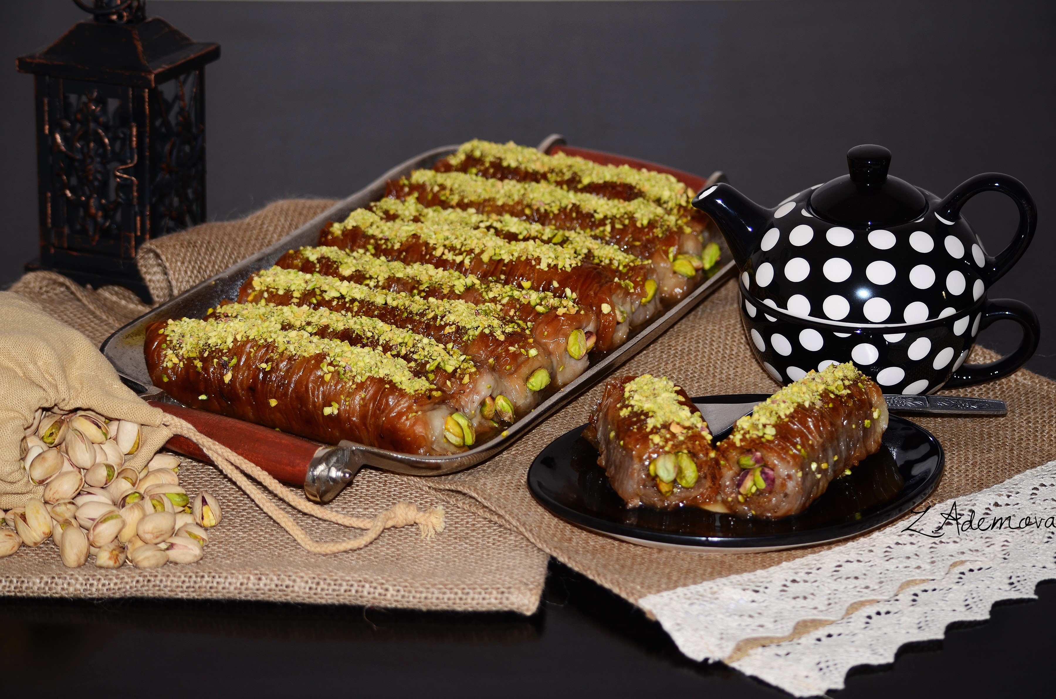 Baklava rolls with pistachios and tea set HD Wallpaper