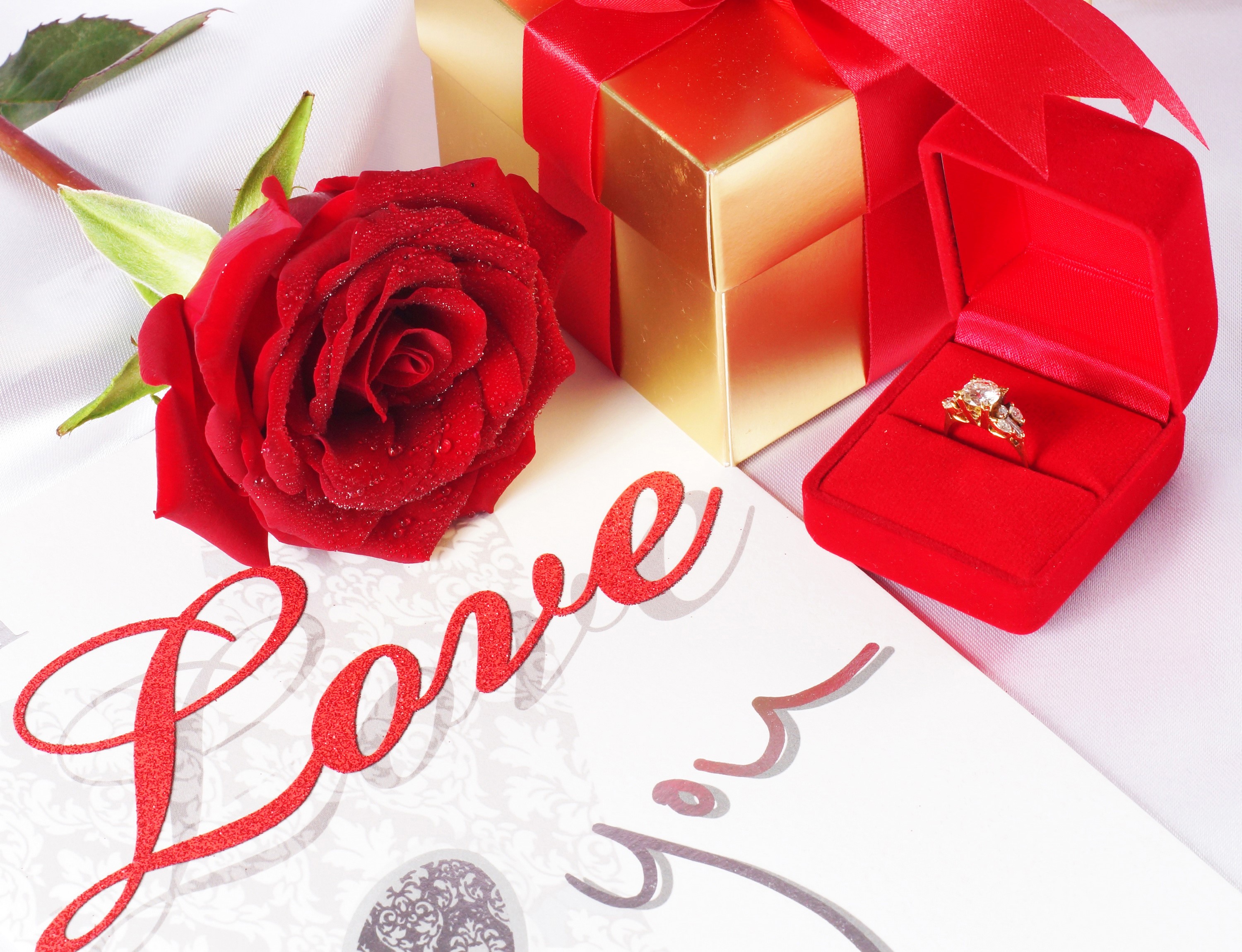 Red rose, engagement ring, gift box, and love card HD Wallpaper