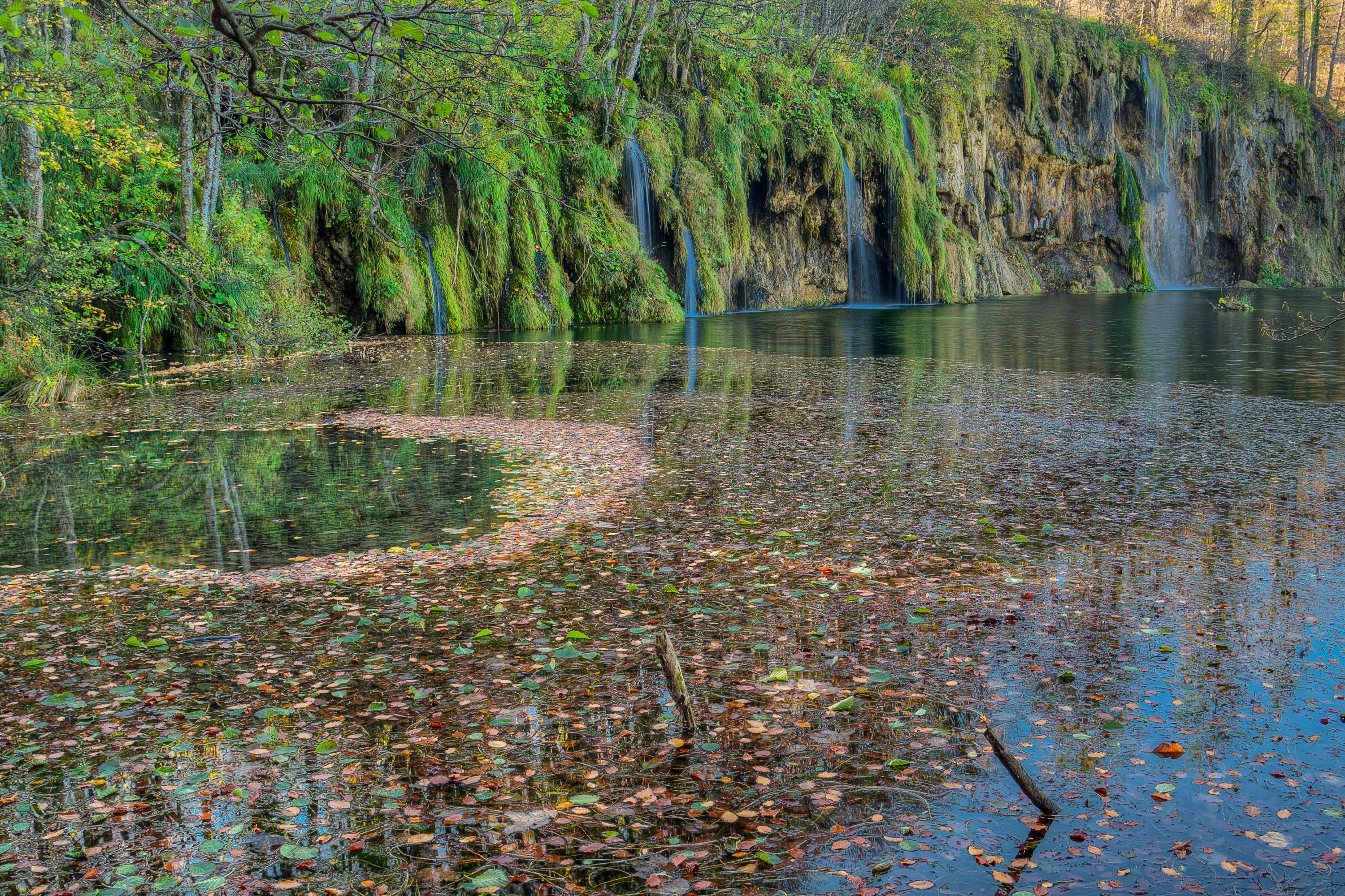 Waterfalls and mossy cliffs at Plitvice Lakes, Croatia HD Wallpaper
