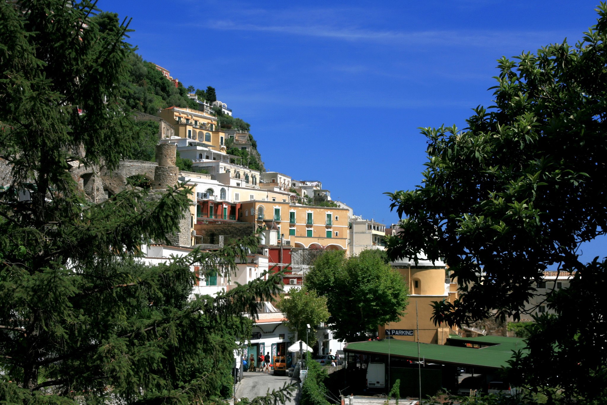 Positano, Italy hillside with houses and trees HD Wallpaper