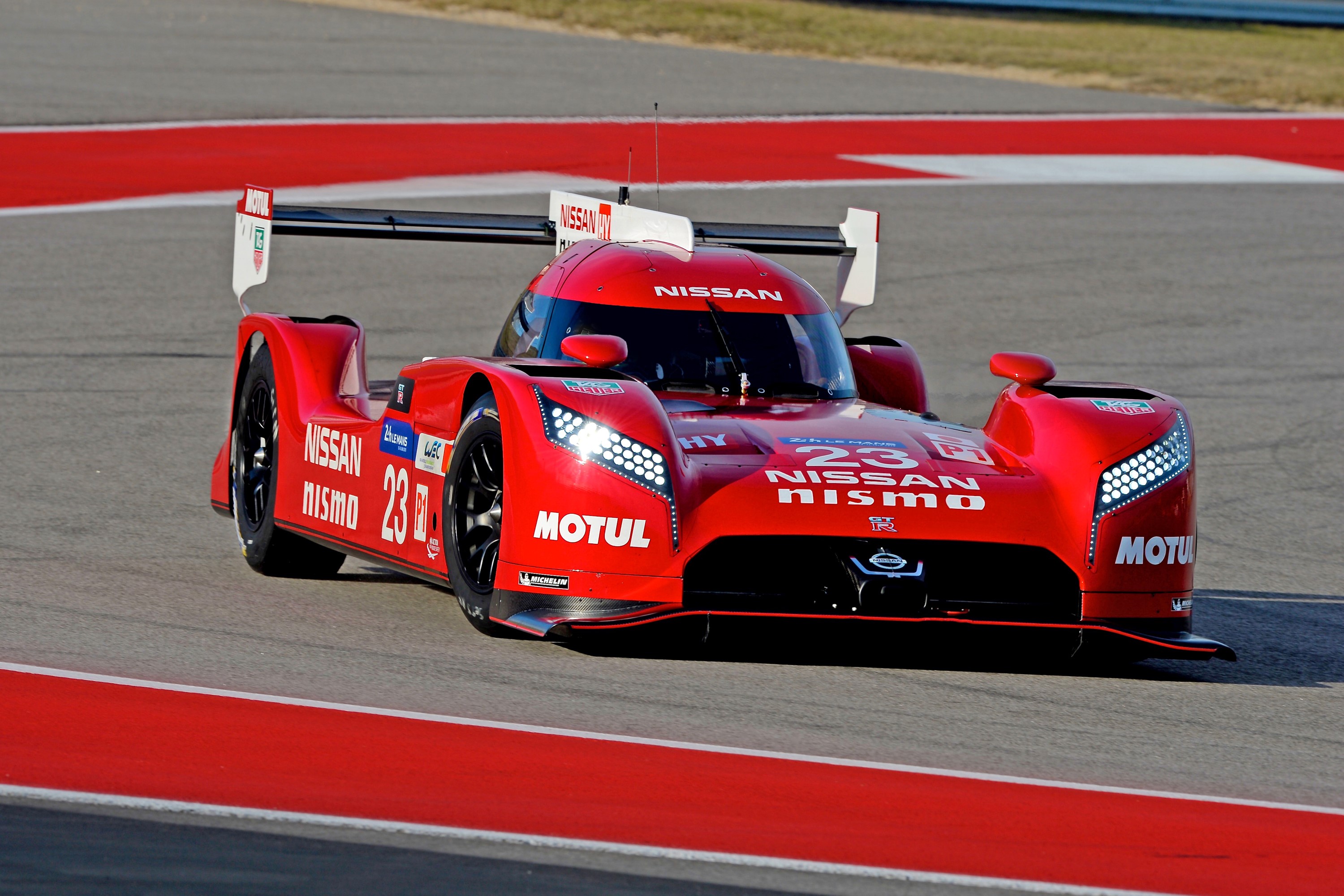 Red Nissan GT-R LM Nismo race car with number 23 HD Wallpaper
