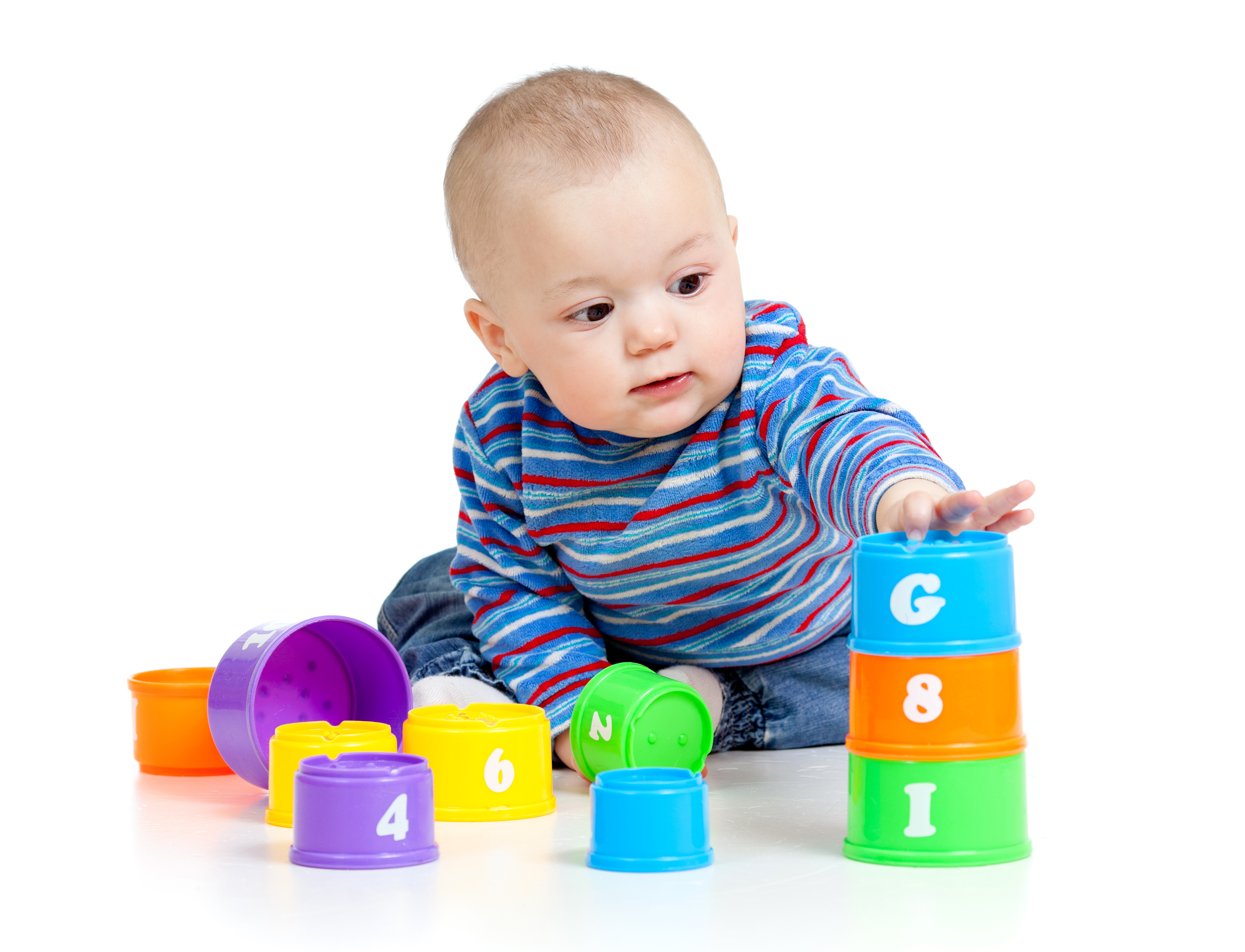 Baby playing with stacking cups HD Wallpaper