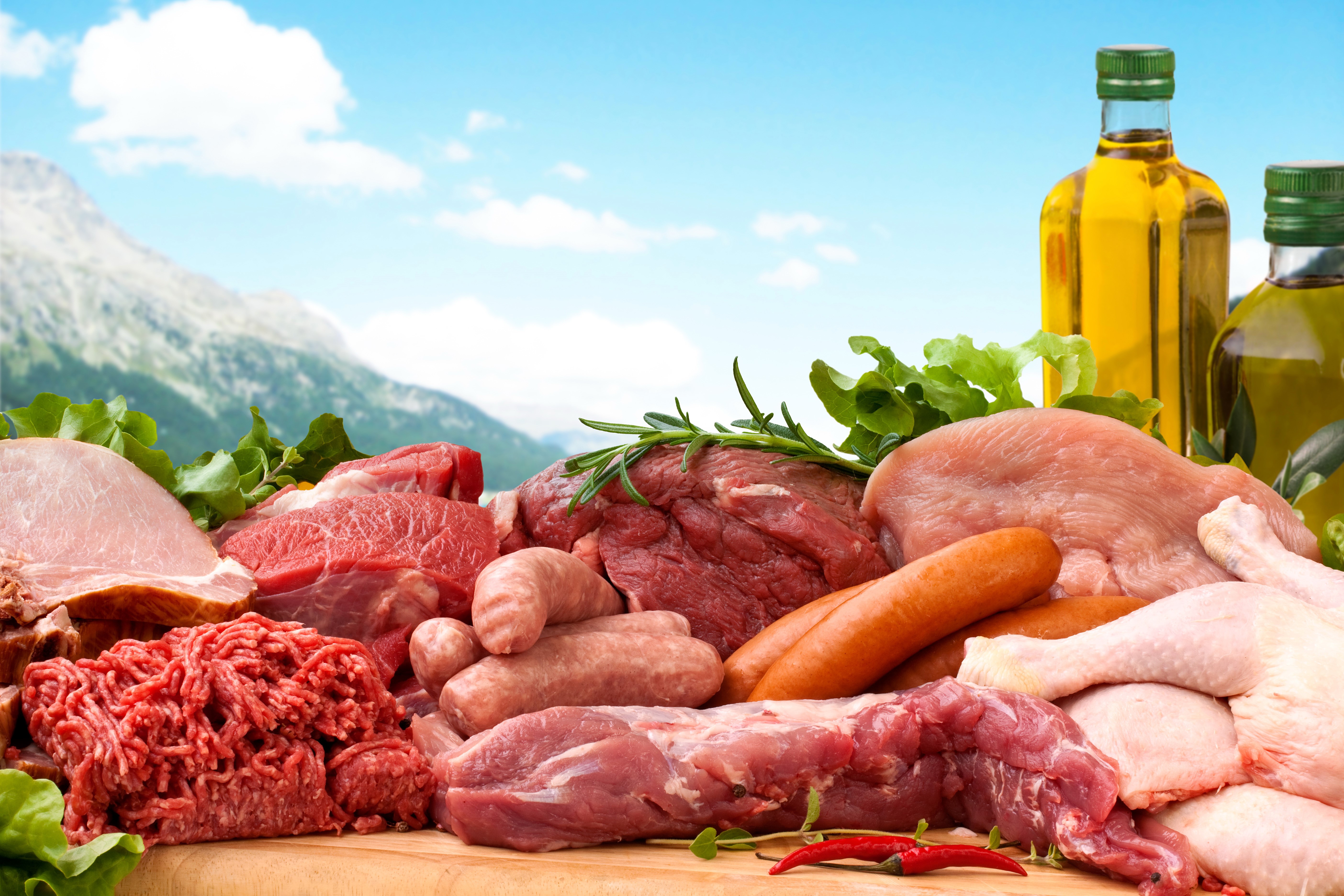 Assortment of Raw Meats and Olive Oil Bottles HD Wallpaper