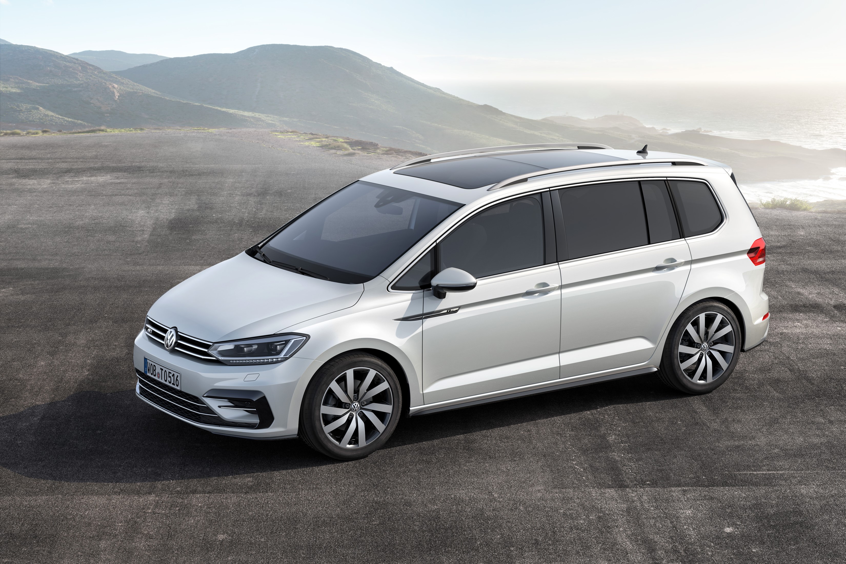 White Volkswagen Touran R-line parked outdoors HD Wallpaper