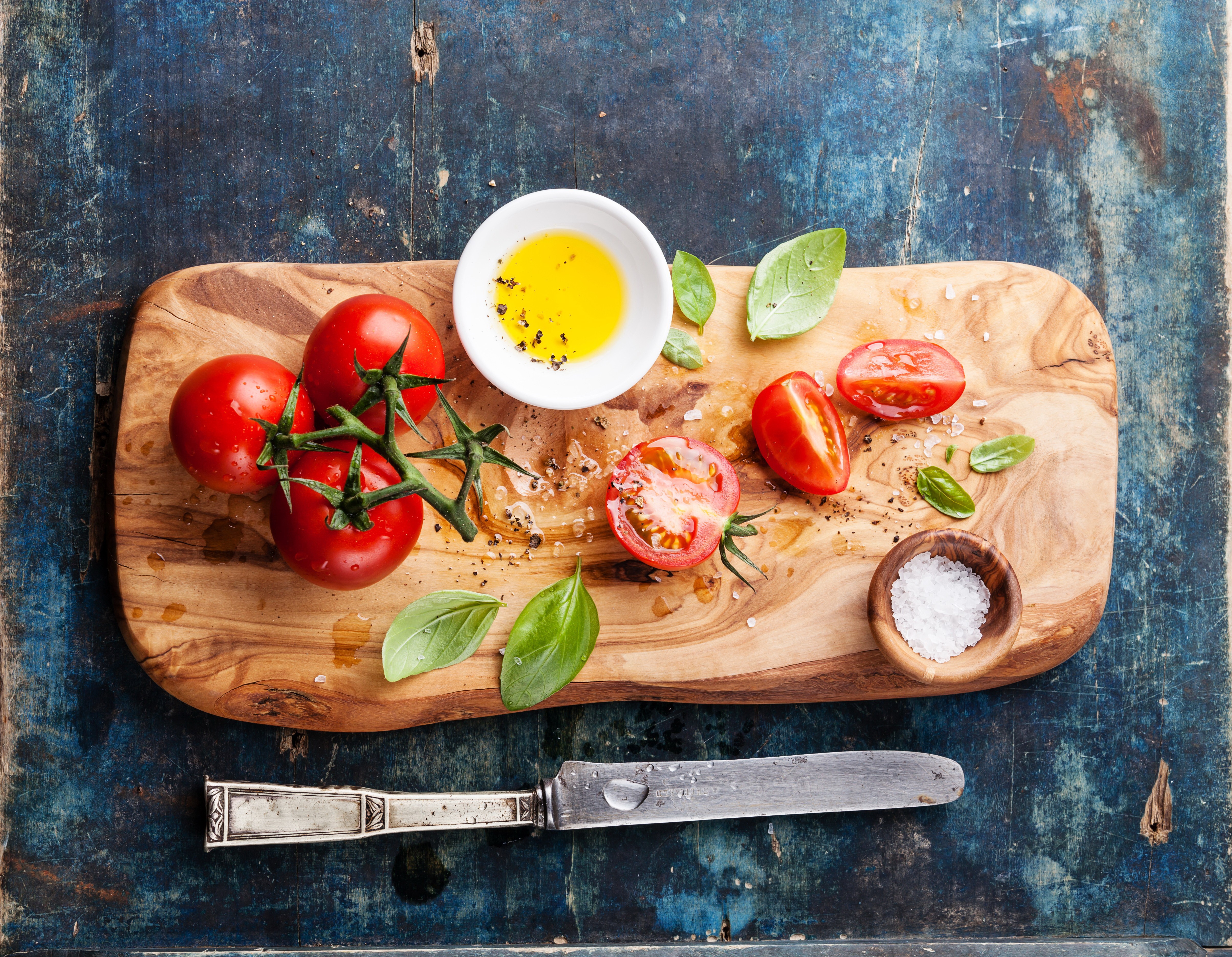 Tomatoes, Basil, Olive Oil, and Salt on a Cutting Board HD Wallpaper