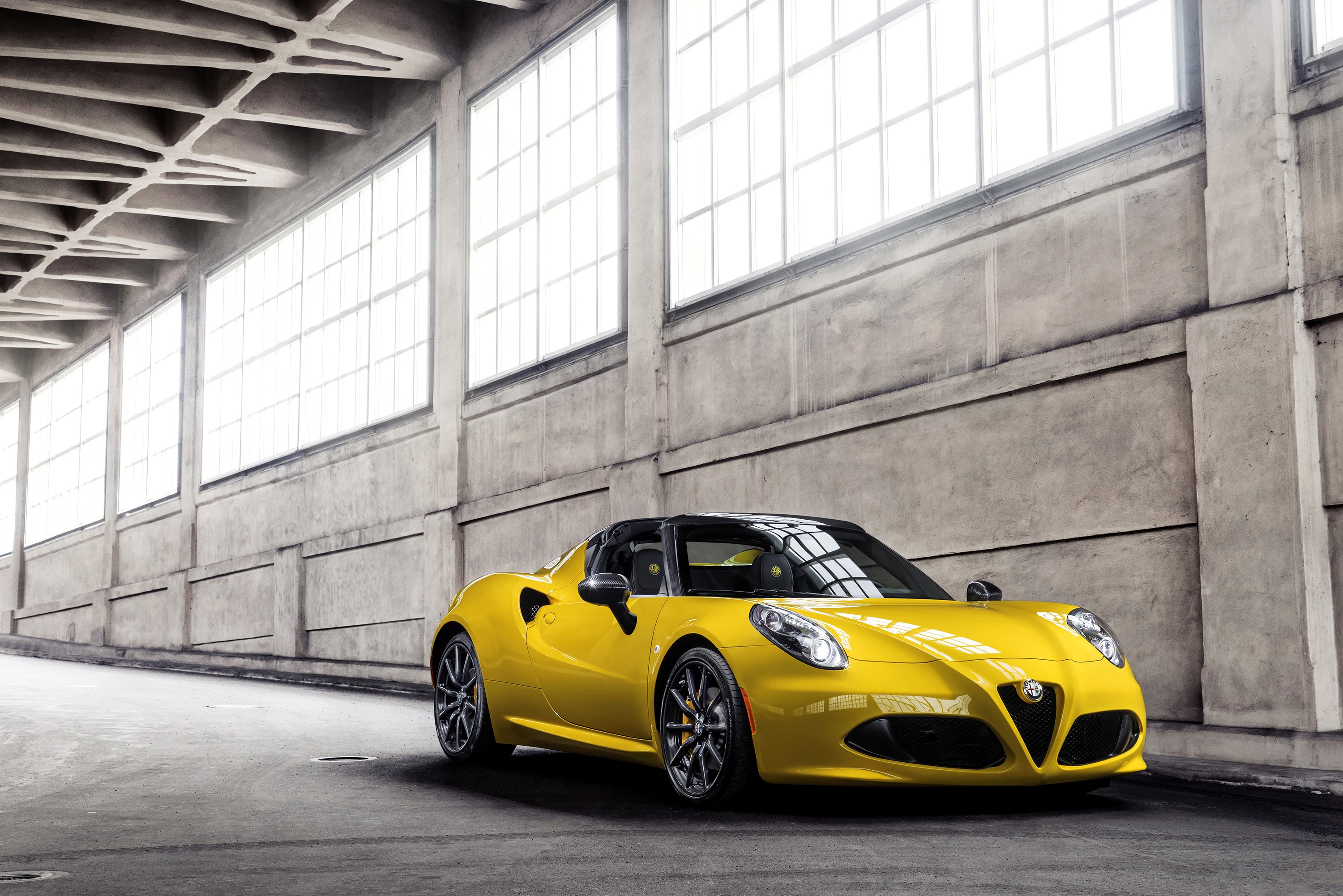 Yellow Alfa Romeo 4C Spider in industrial building HD Wallpaper